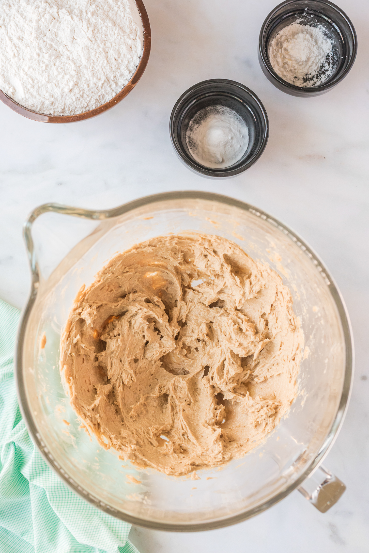 Mixing bowl with butter and sugars creamed plus egg mixed in