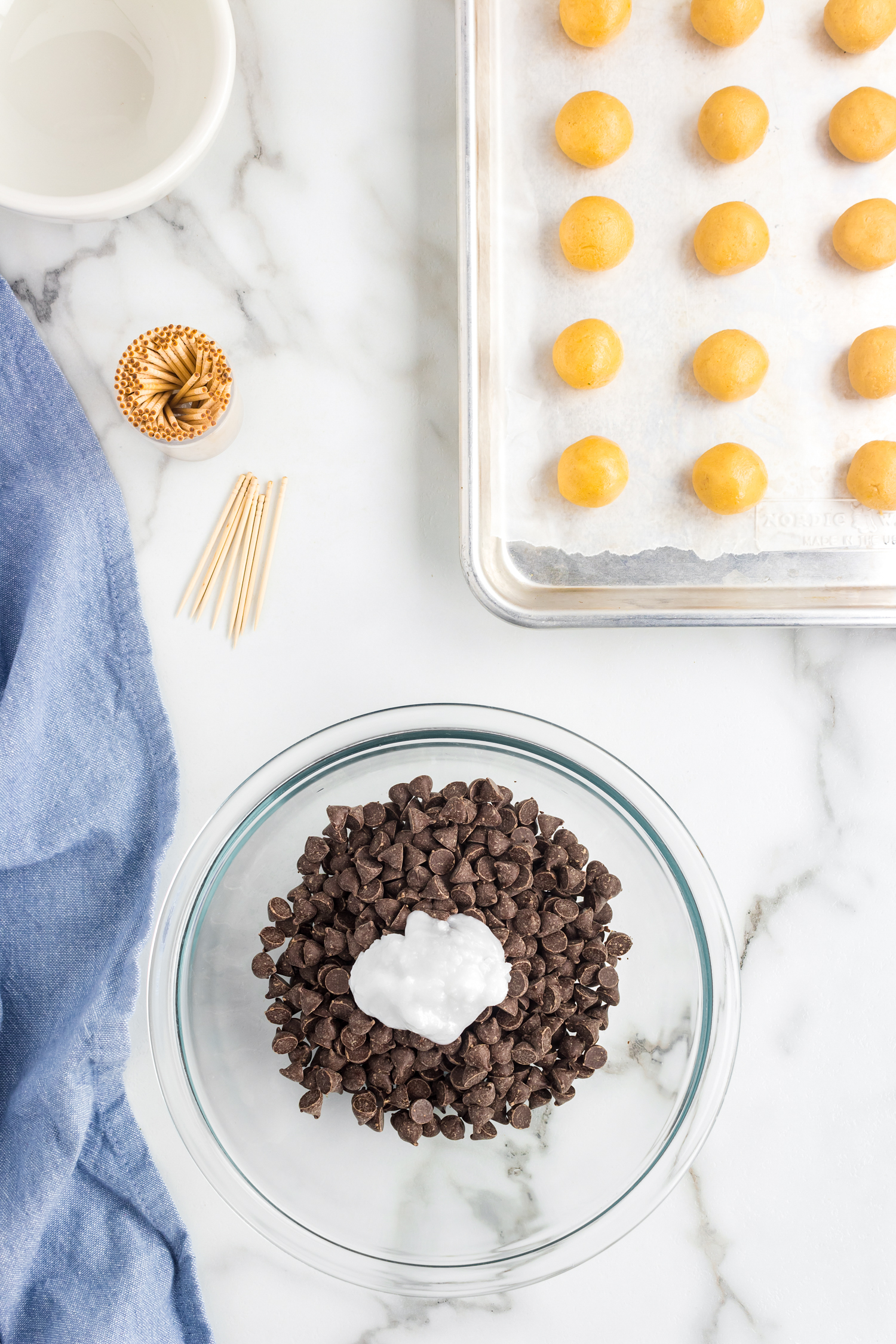 Glass bowl with chocolate chips and coconut oil