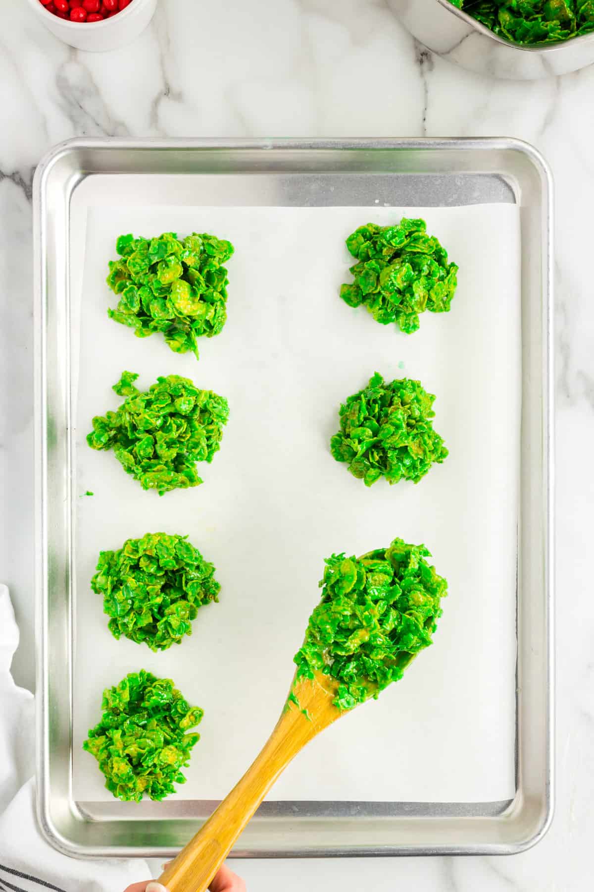 Scoop spoonfuls of green cornflake mixture onto sheet pan