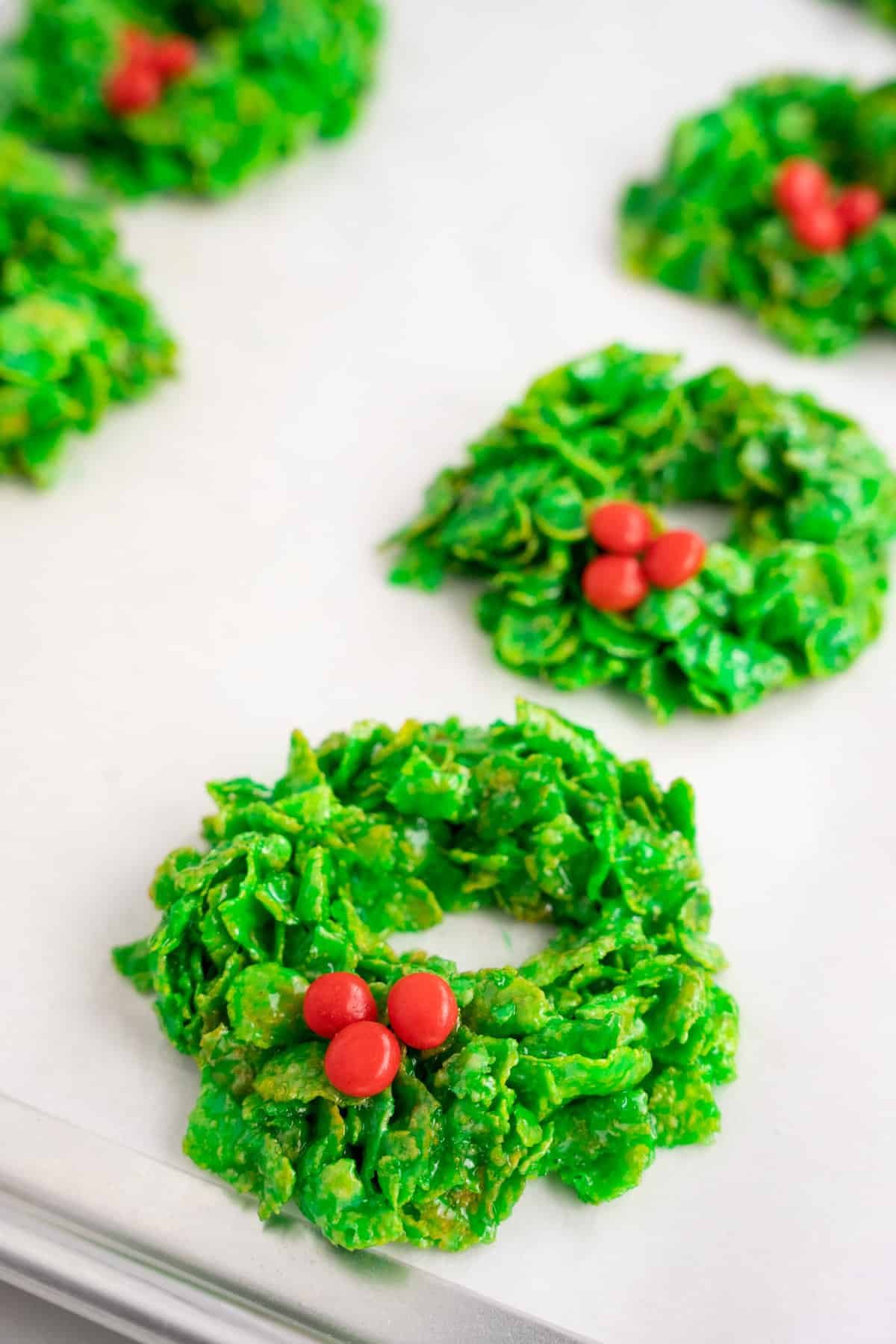 Sheet pan with cornflake Christmas wreaths and red hots