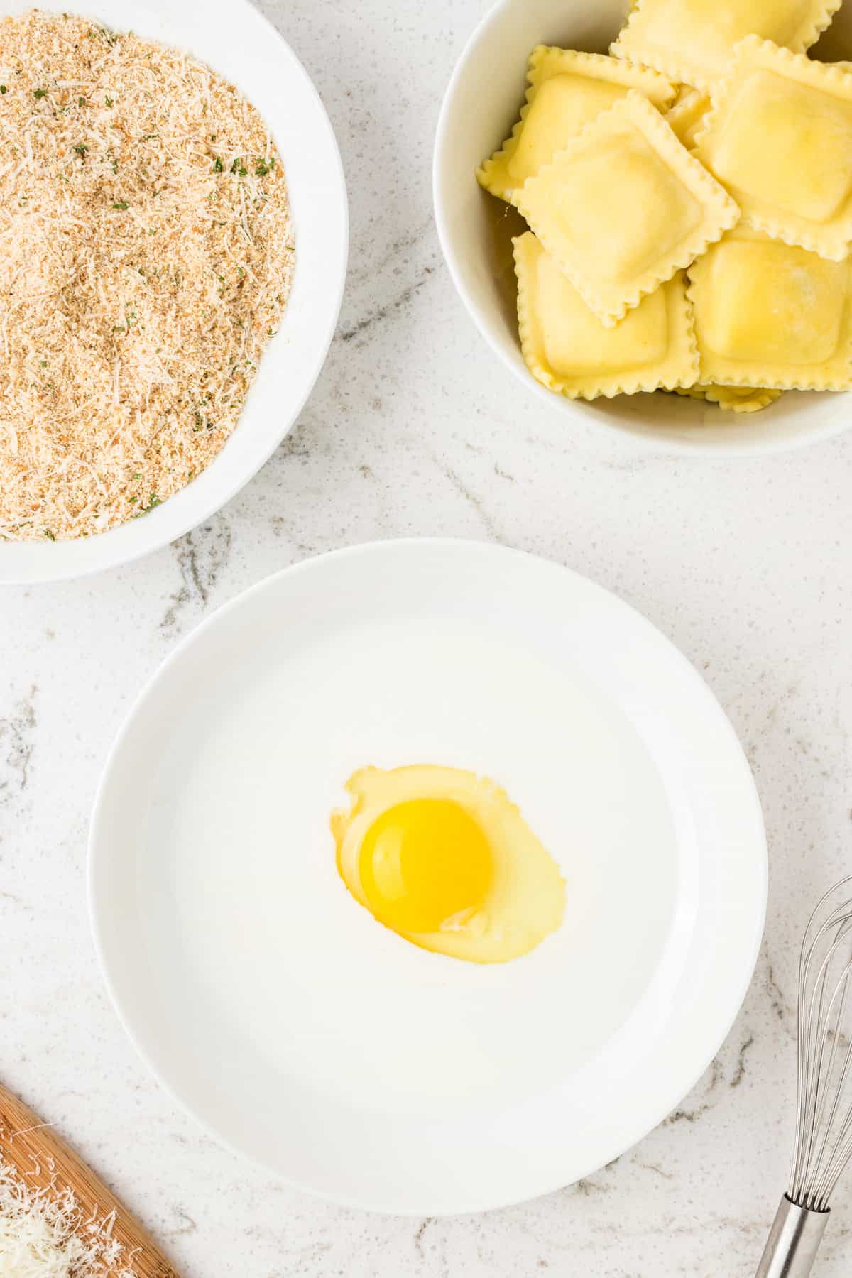 Overhead image of egg and uncooked ingredients