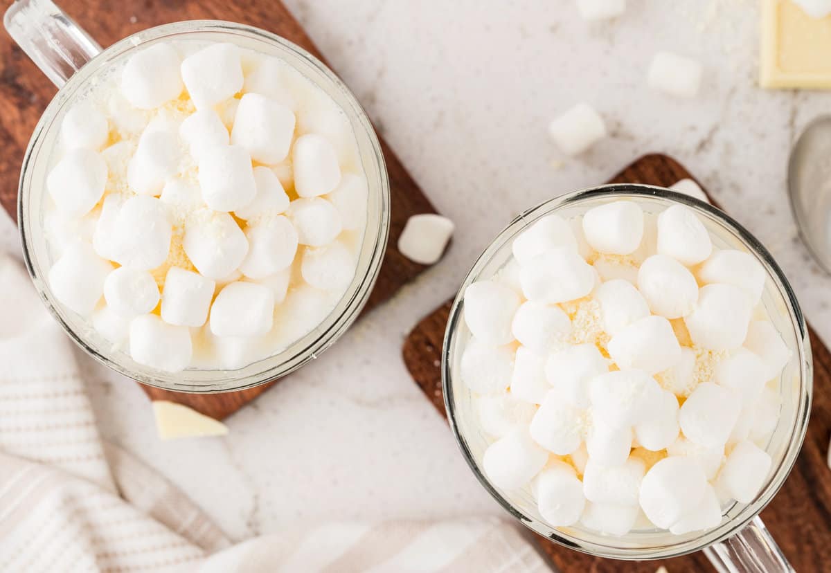Overhead image of Homemade White Hot Chocolate in mugs with marshmallows