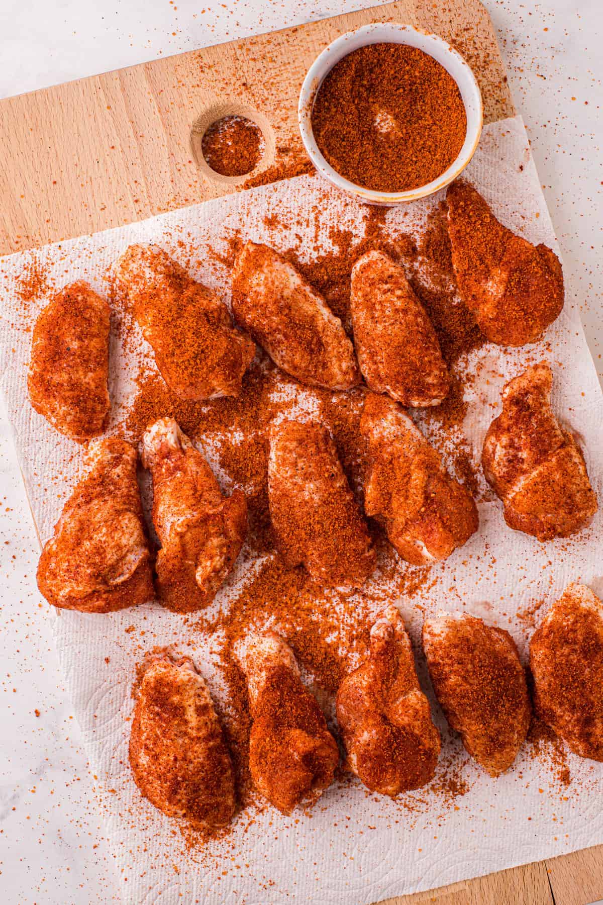 Overhead Image of Chicken Wings with Buffalo Seasoning on Paper Towel