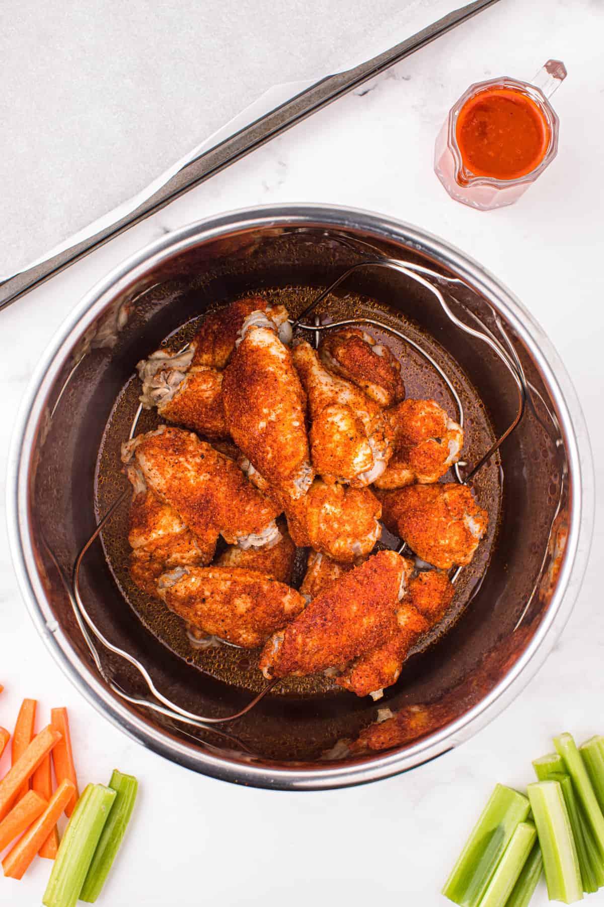 Instant Pot Chicken Wings with Buffalo Sauce in Cooker