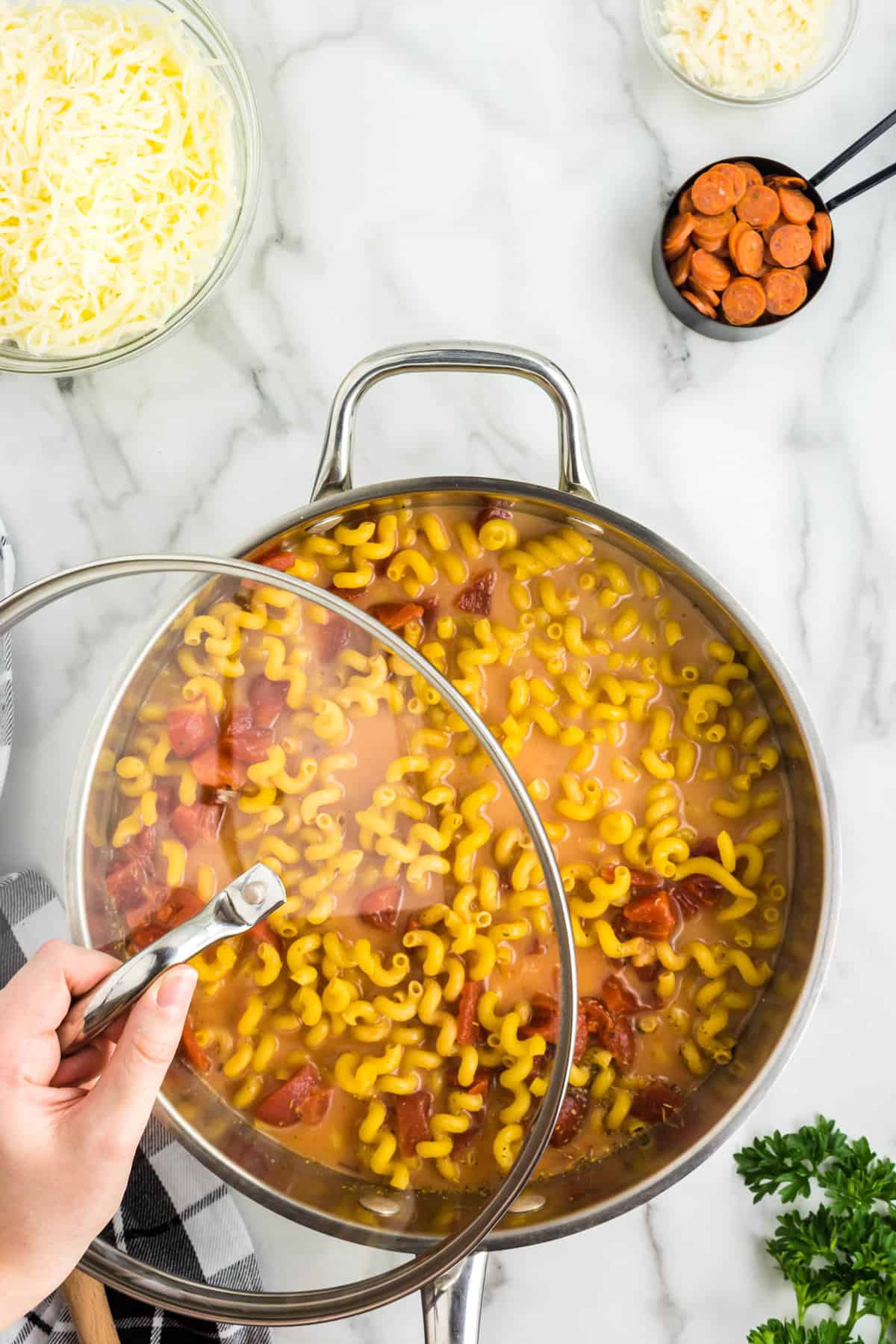 One Pot Pizza Pasta Recipe Covered to Bring Ingredients to a Boil