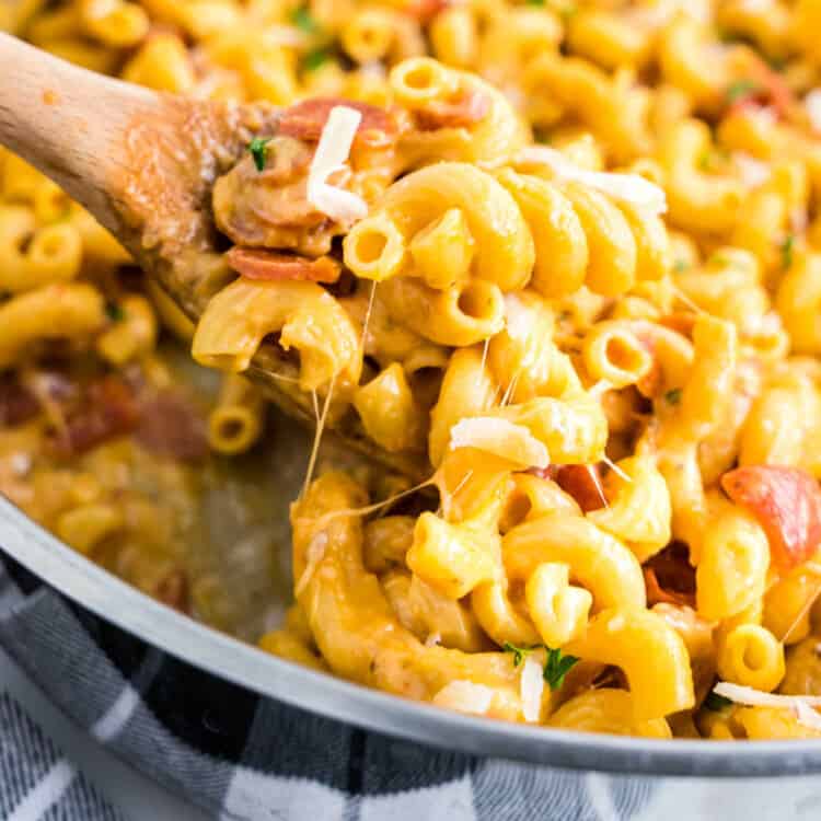 One Pot Pizza Pasta Square Image of Wooden Spoon Scooping Pasta from Baking Dish