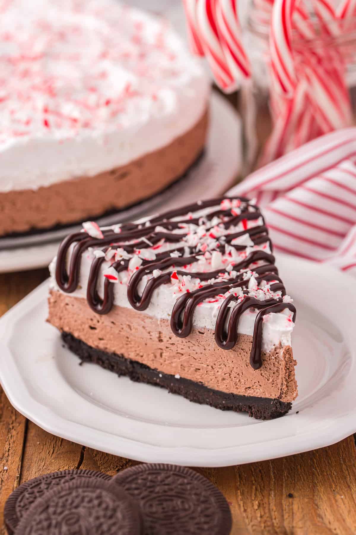 Slice of Peppermint Cheesecake on white plate