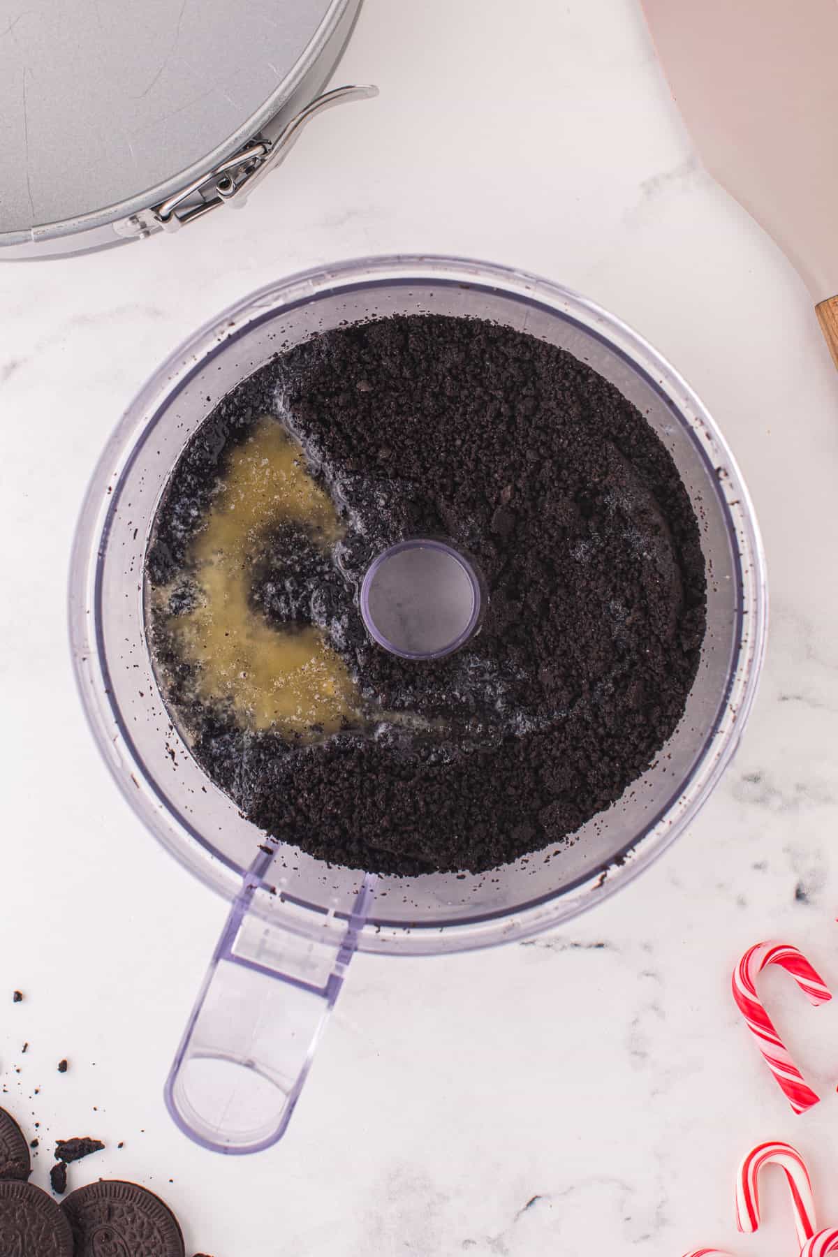 Butter and chopped Oreos in food processor