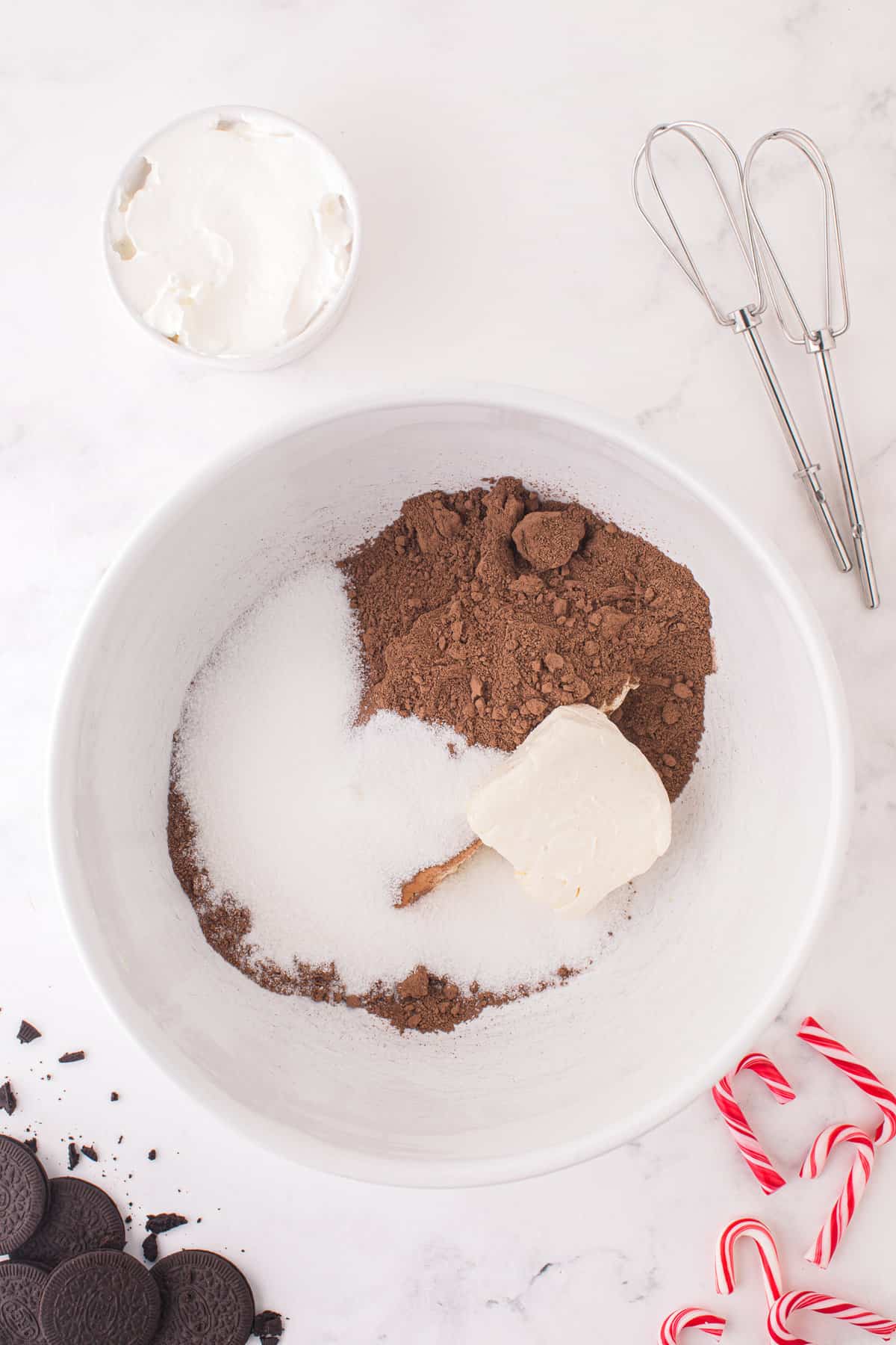 Ingredients for chocolate cheesecake filling in bowl