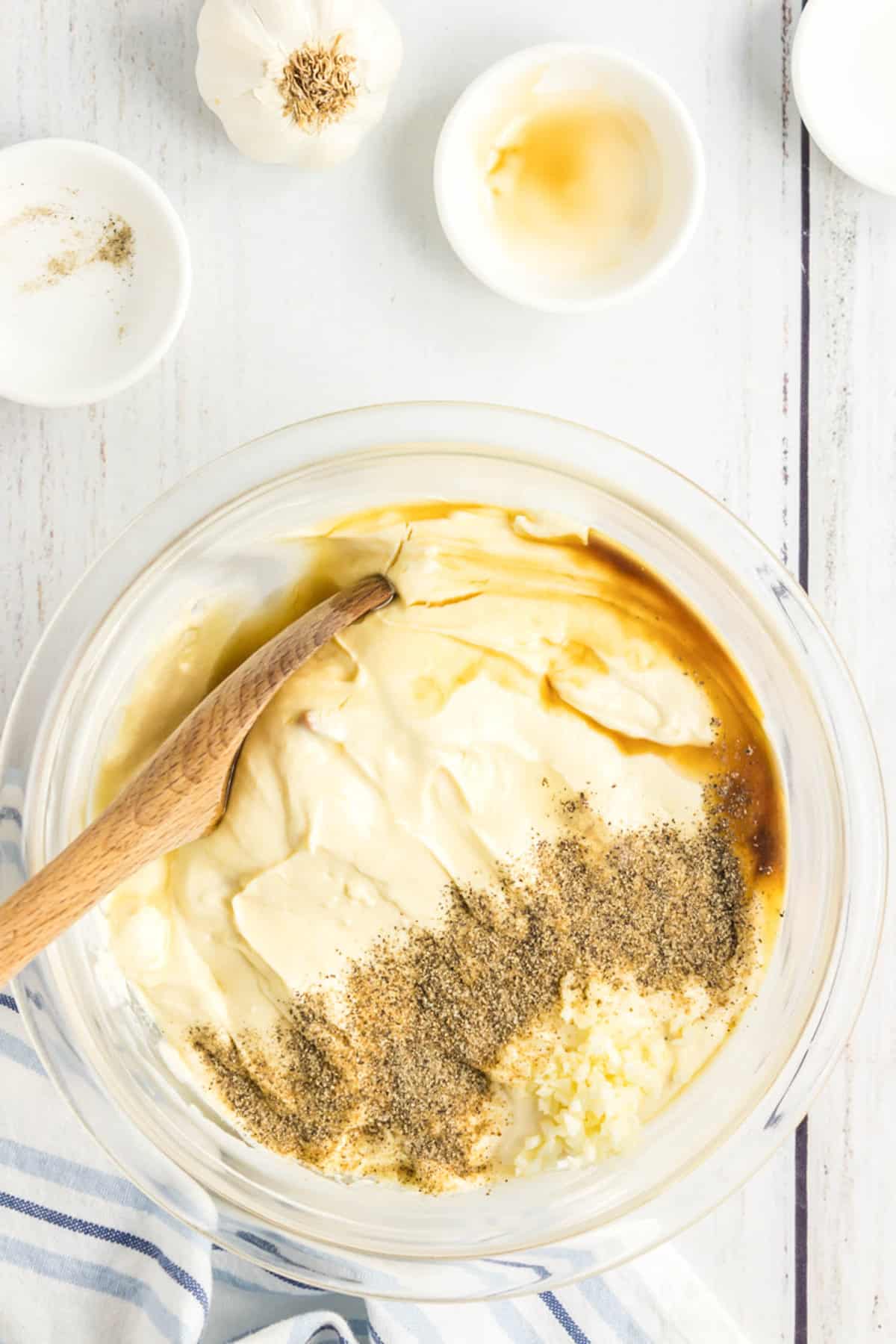 Mixing seasoning with cream of soup in mixing bowl