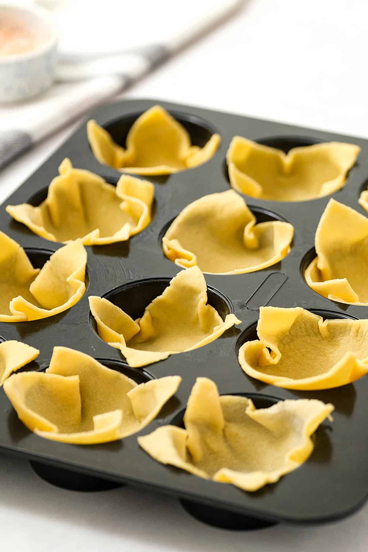 Assembling the Wonton Wrappers in Muffin Tins