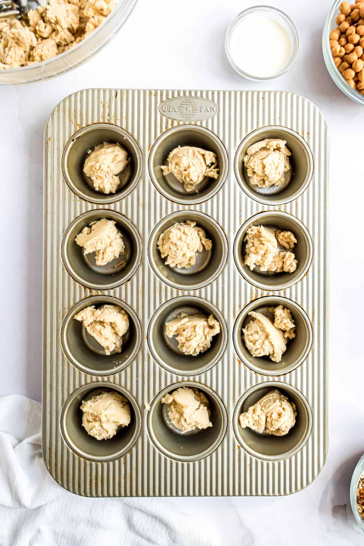 Cookie dough in muffin pan tin
