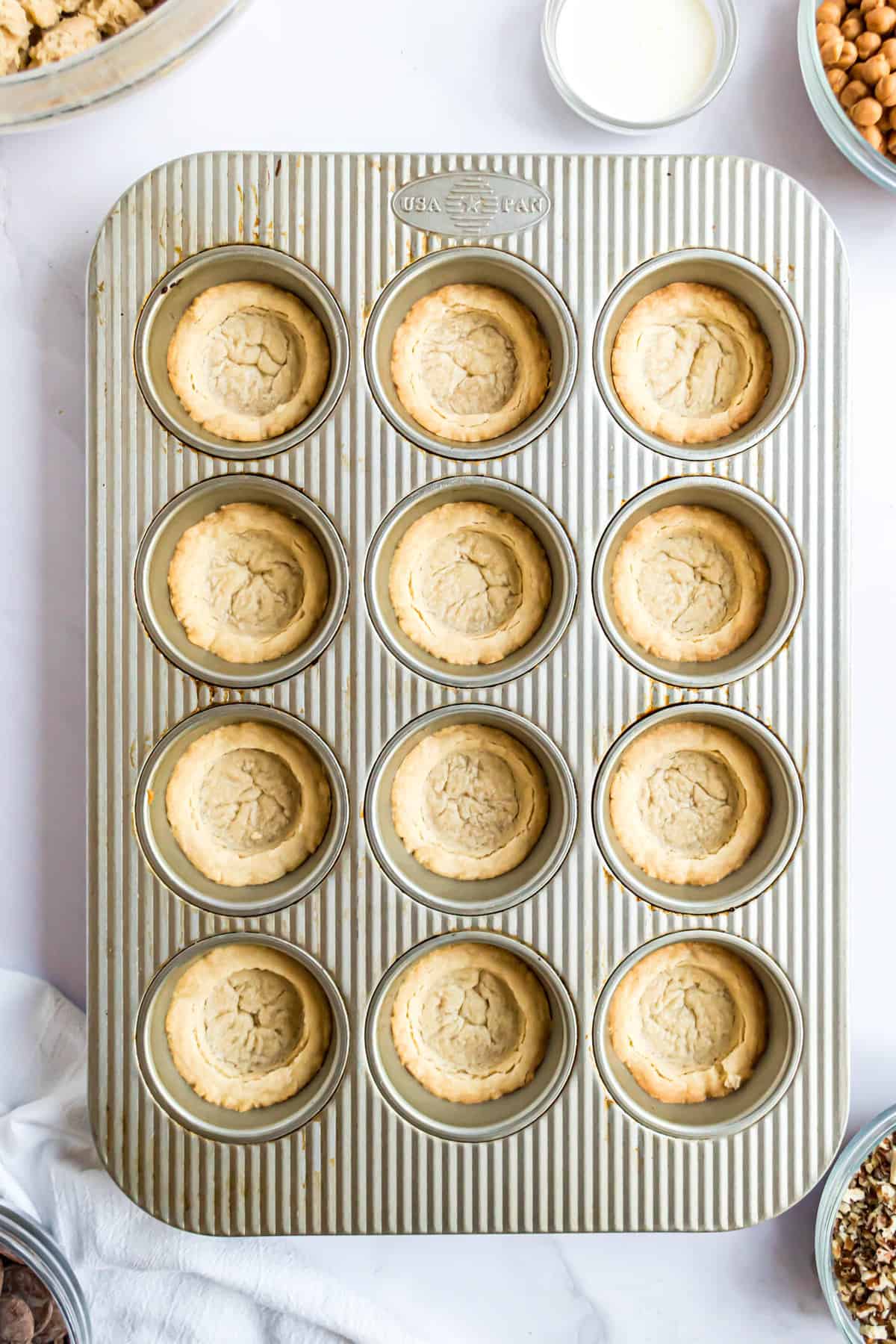 Cookie cups in muffin pan cooling