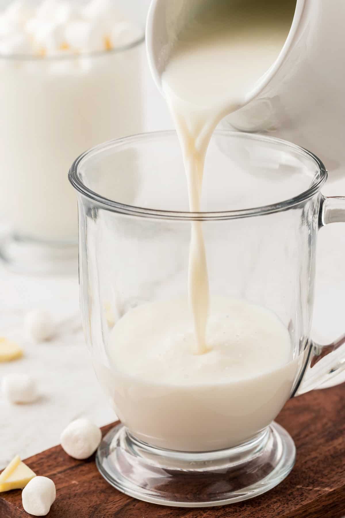 Pouring white hot chocolate into glass must