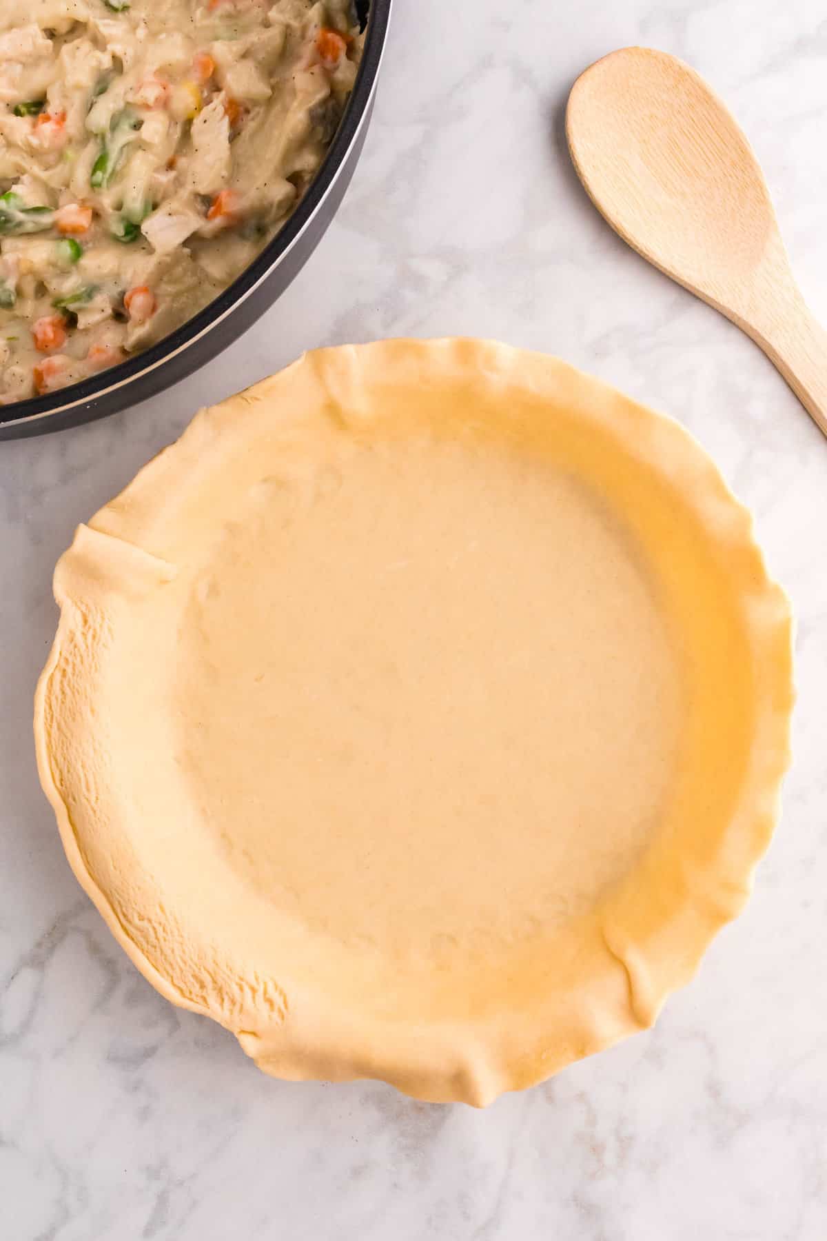 Overhead Image of Refridgerated Pie Crust in Pie Tin