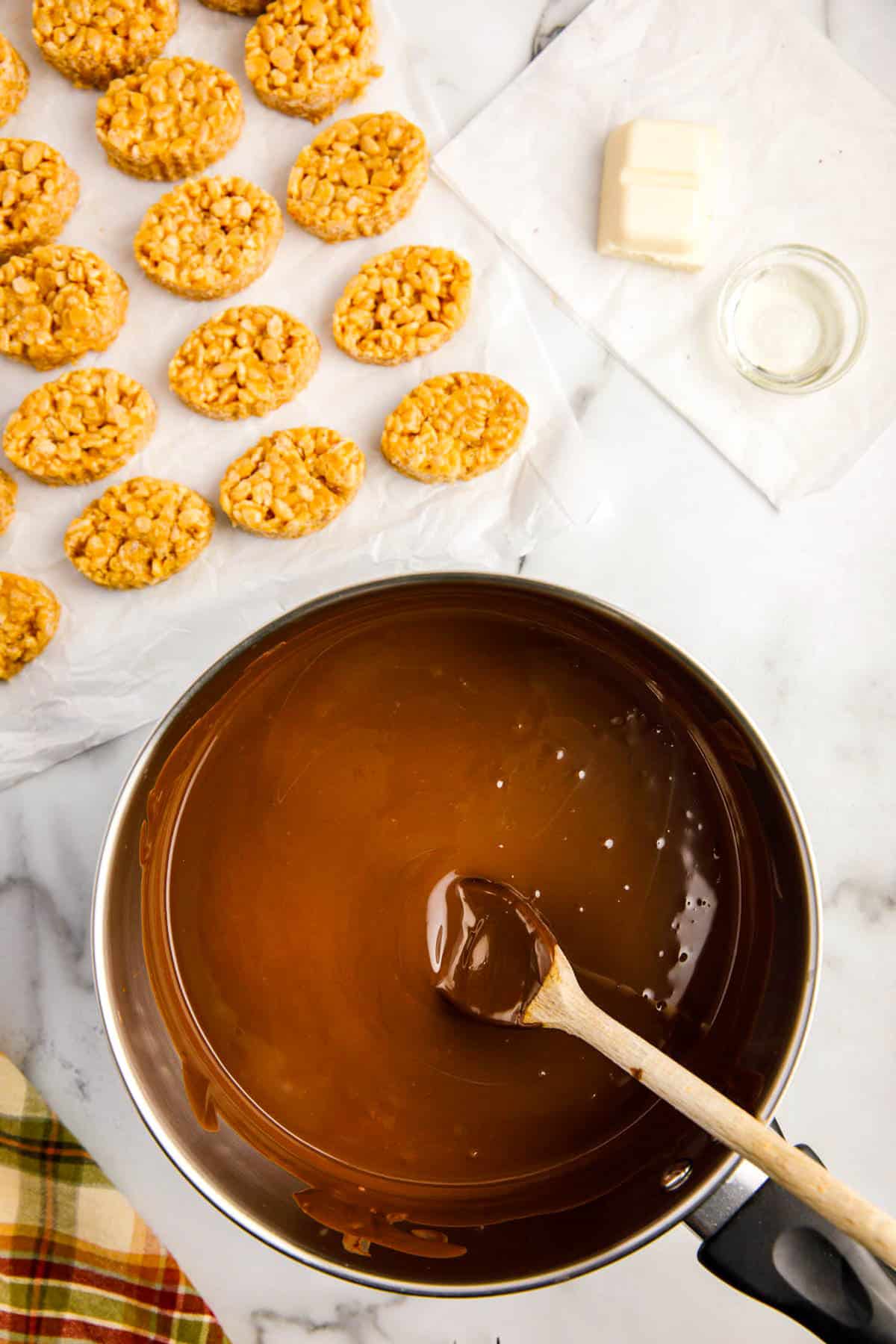 Chocolate Candiquik Melted in Saucepan with Wooden Spoon