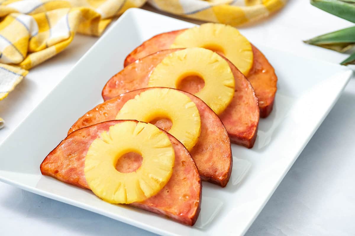 Easy Dinner Recipe with Ham Steaks and Pineapple Overhead Image on White Plate