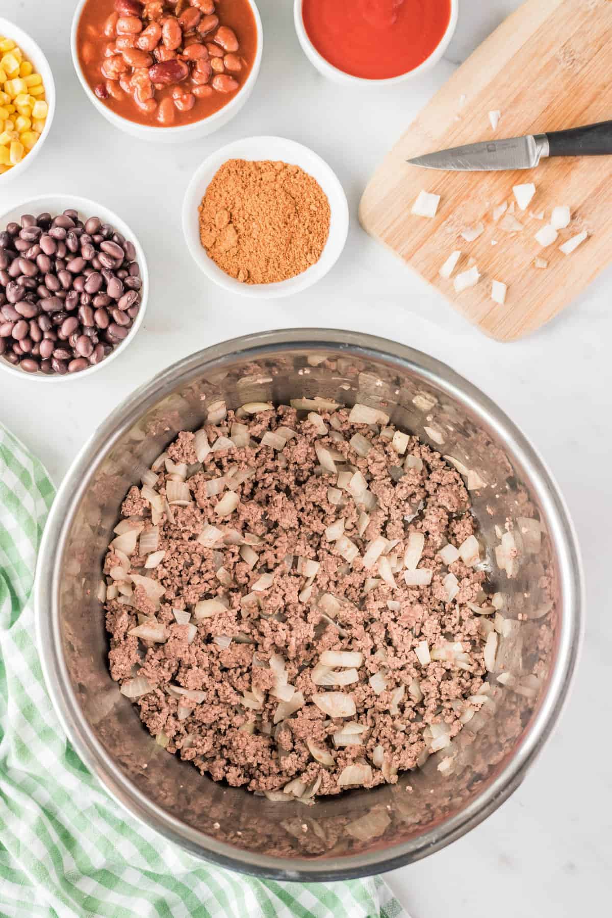 Using the Saute Mode on the Pressure Cooker to Brown the Ground Beef and Onion