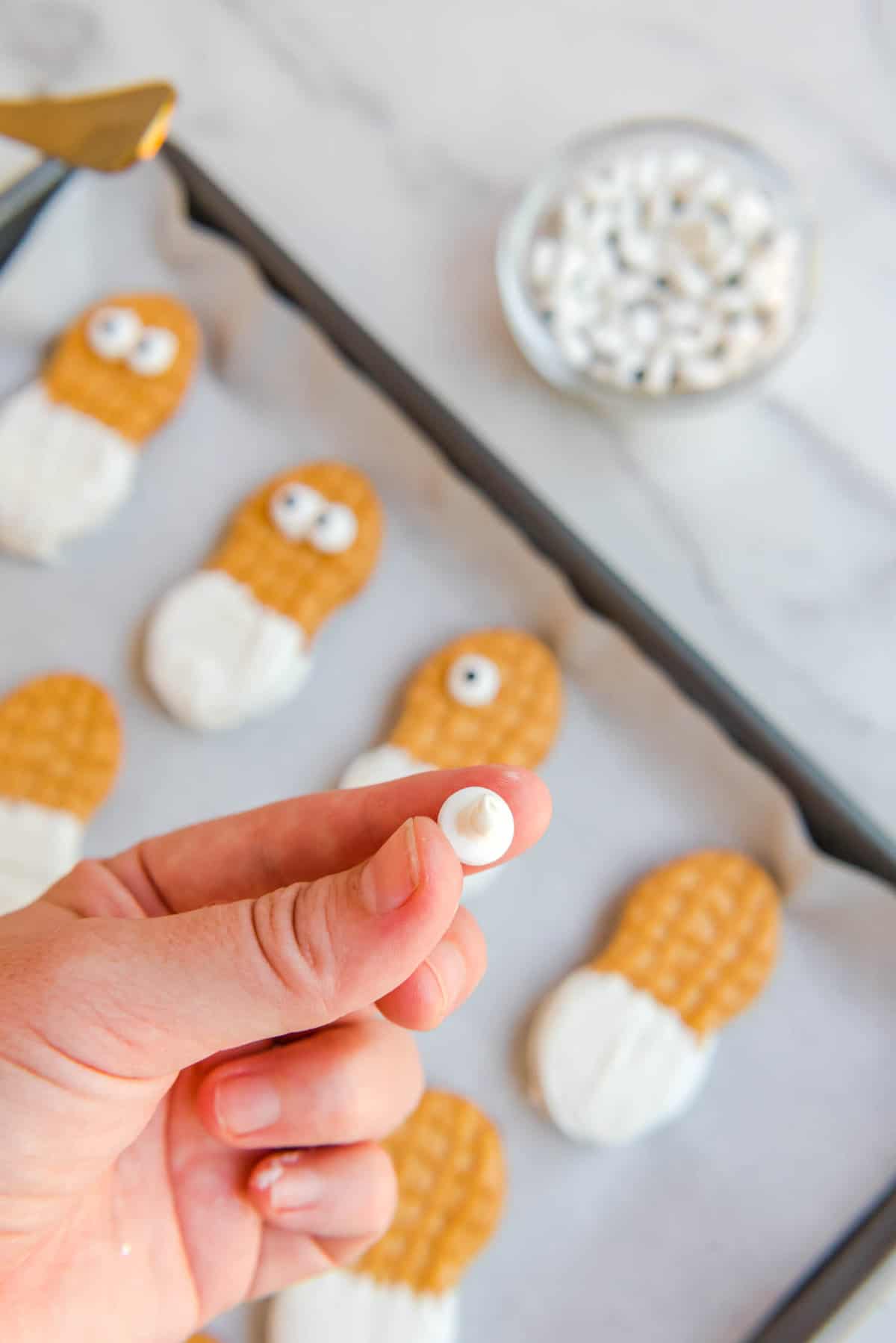 Dab of White Candy Melt on Candy Eye Balls for Nutter Butter Referees