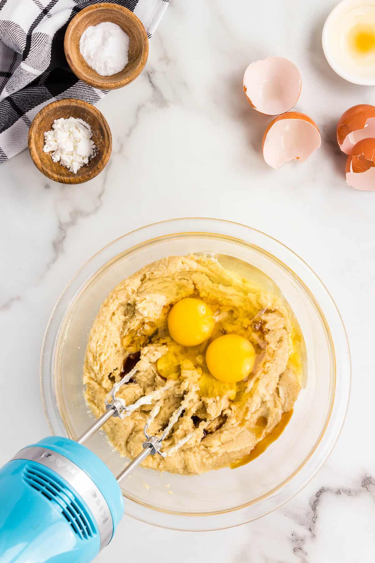 Mixing Eggs into Sugar and Butter Blend for PIzookie Recipe