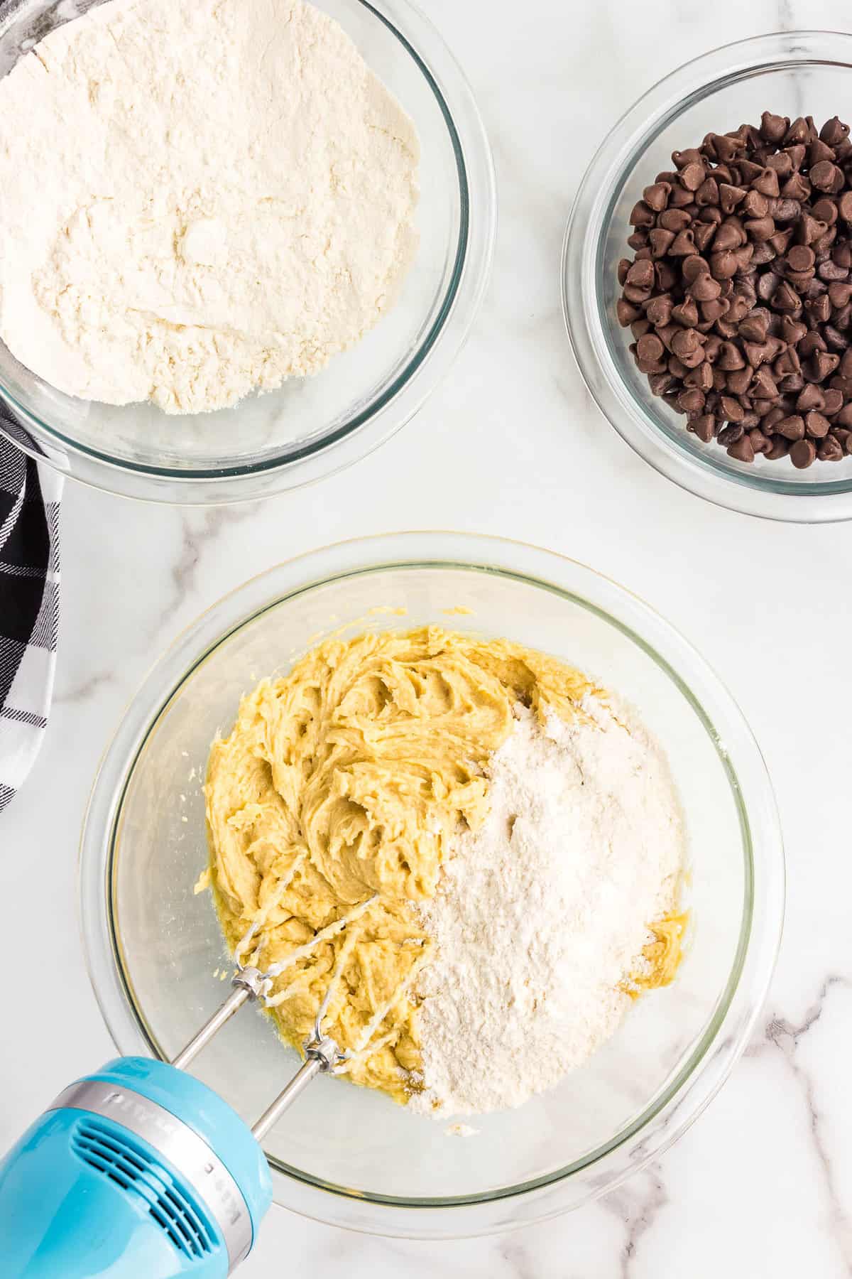 Pizookie Recipe Mixing Ingredients in Bowl with Hand Mixer