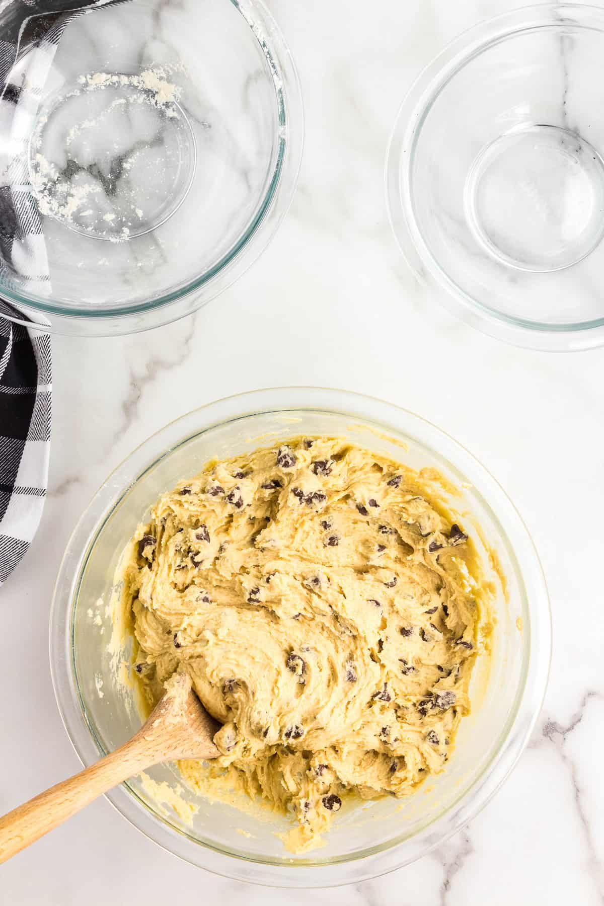 Stirring in Chocolate Chips for Pizookie Skillet Recipe