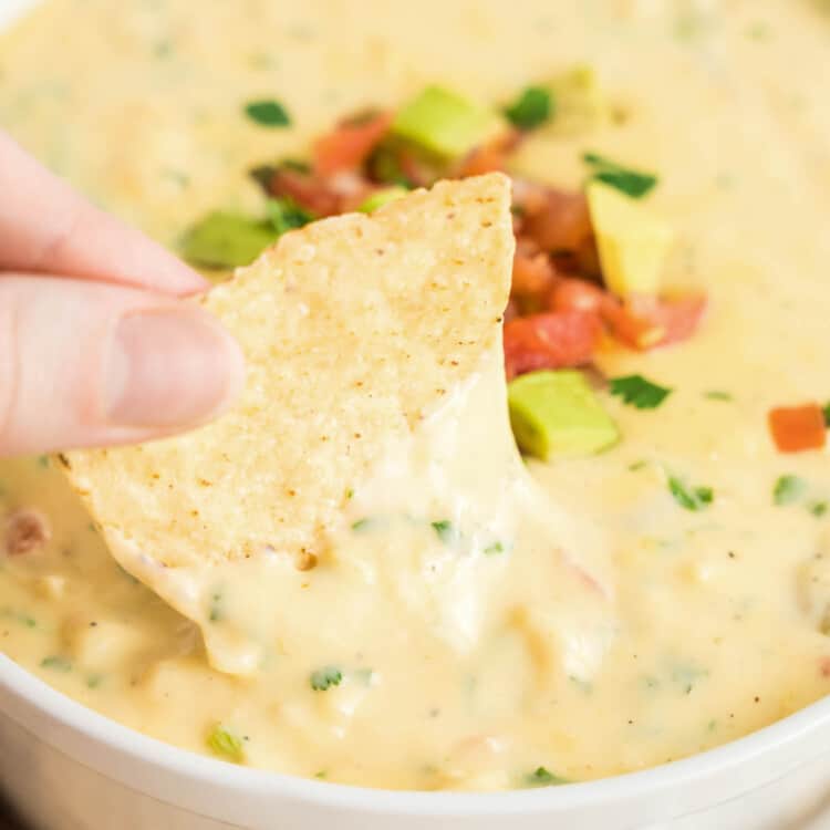 Queso Dip Recipe in White Bowl Topped with Pico Ready to Enjoy