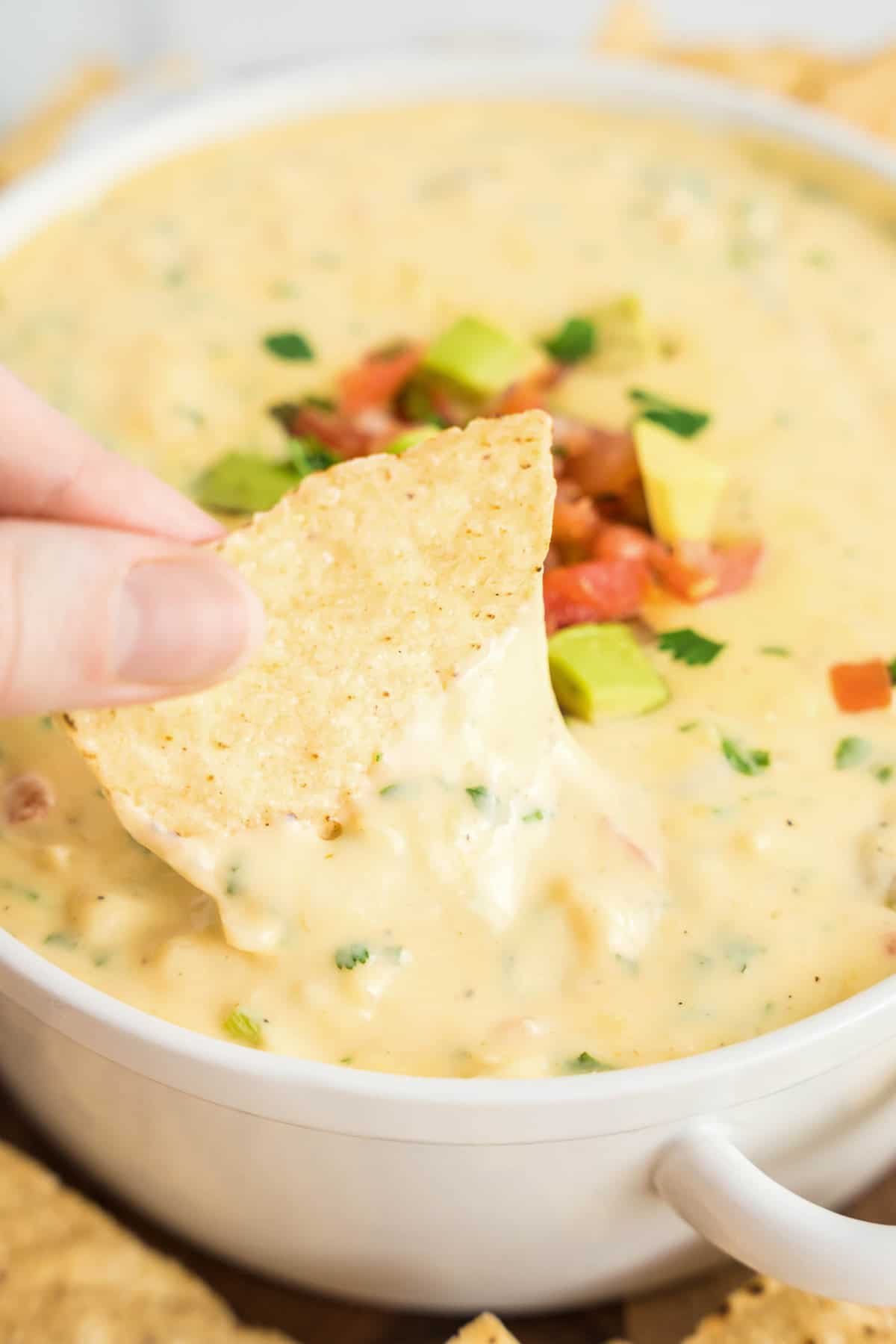 Queso Dip Recipe in White Bowl Topped with Pico Ready to Enjoy