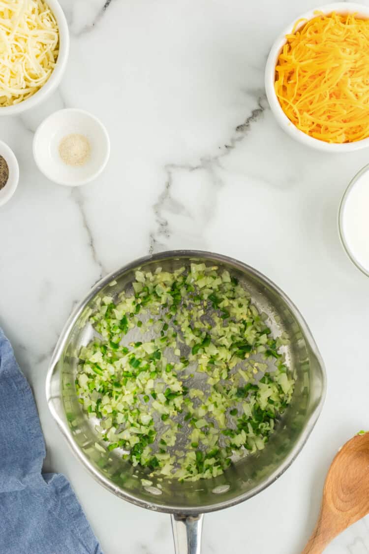 Heating Butter, Diced Onion and Jalapeno in Saucepan for Queso Dip