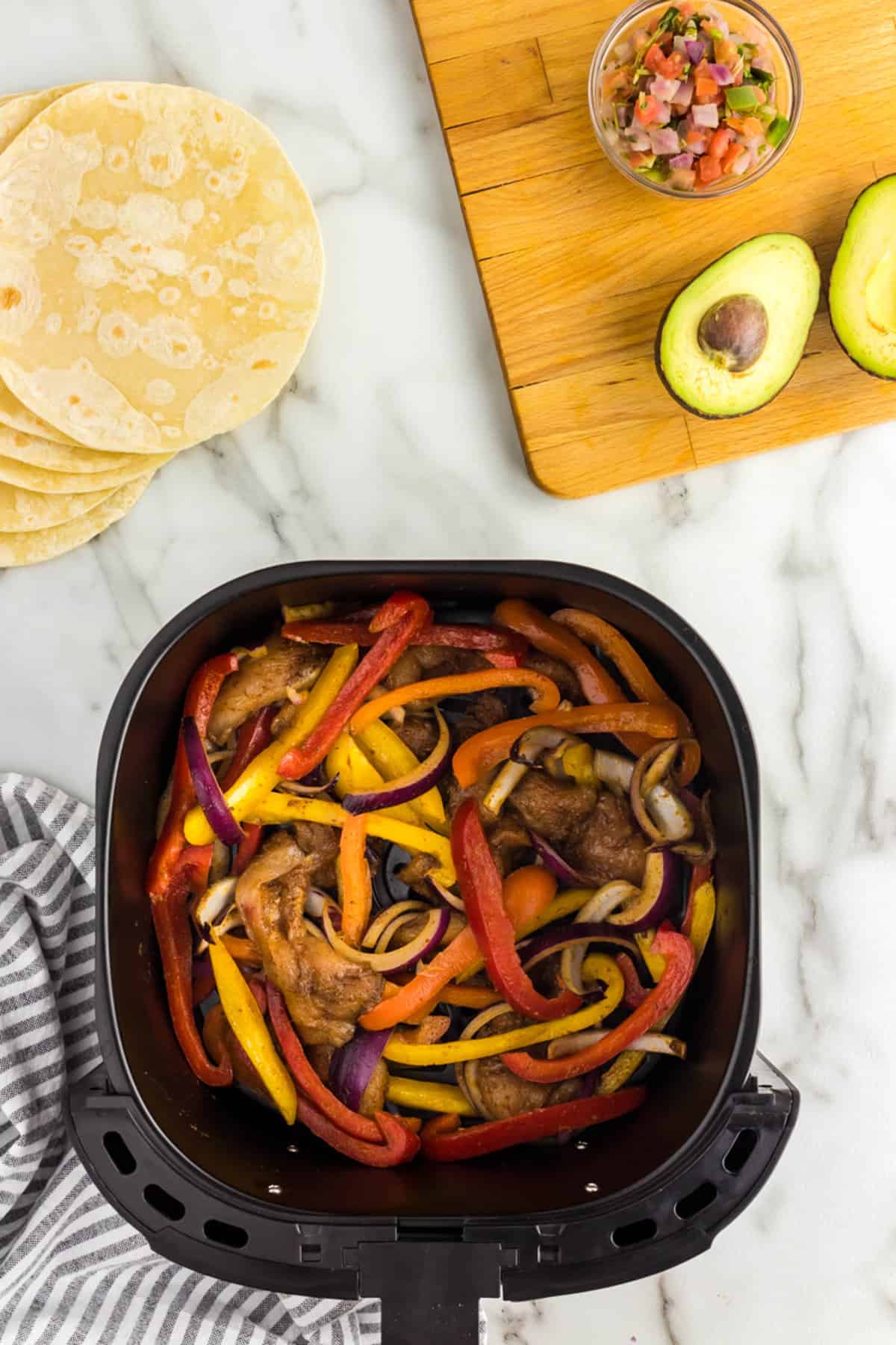 Placing Mixture into Air Fryer Basket for Chicken Fajitas