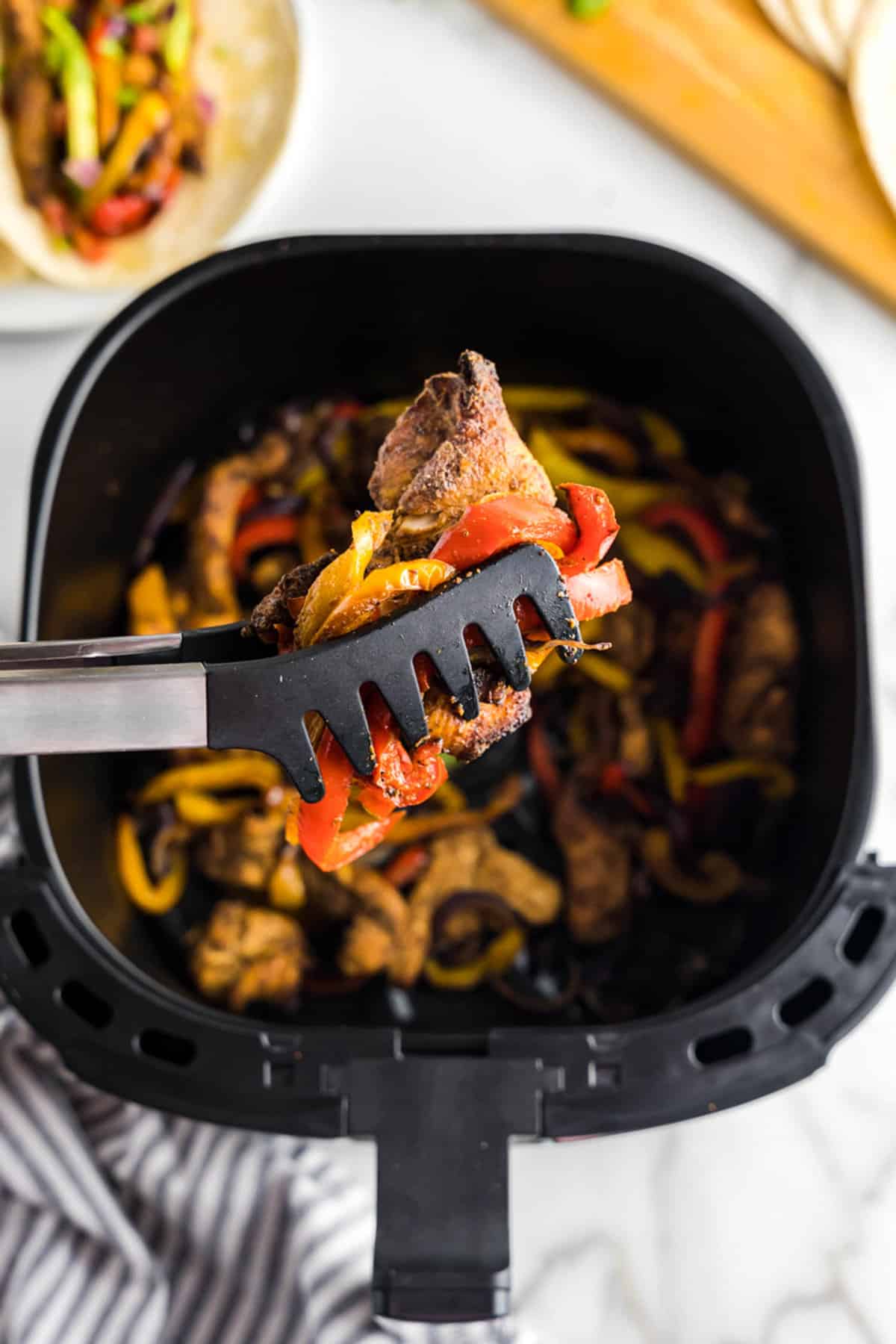 Tossing Mixture in the Air Fryer for Chicken Fajitas