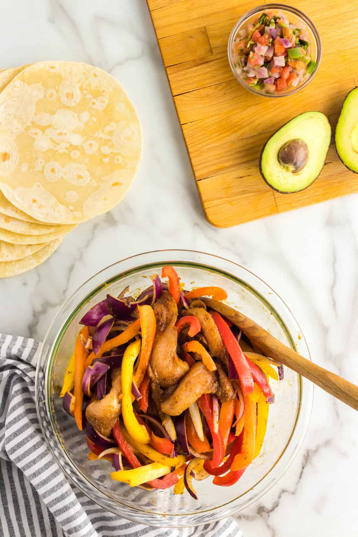 Combining Peppers and Onions with Chicken Mixture for Air Fryer Chicken Fajitas