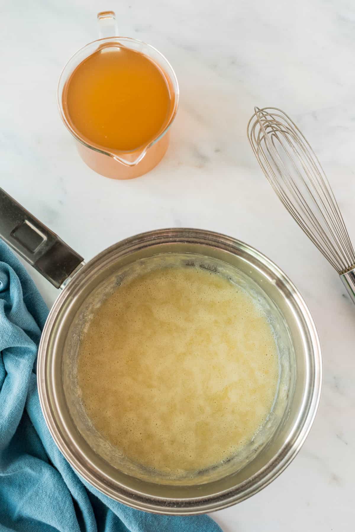 Adding Ingredients to Creamy Beer Cheese Soup