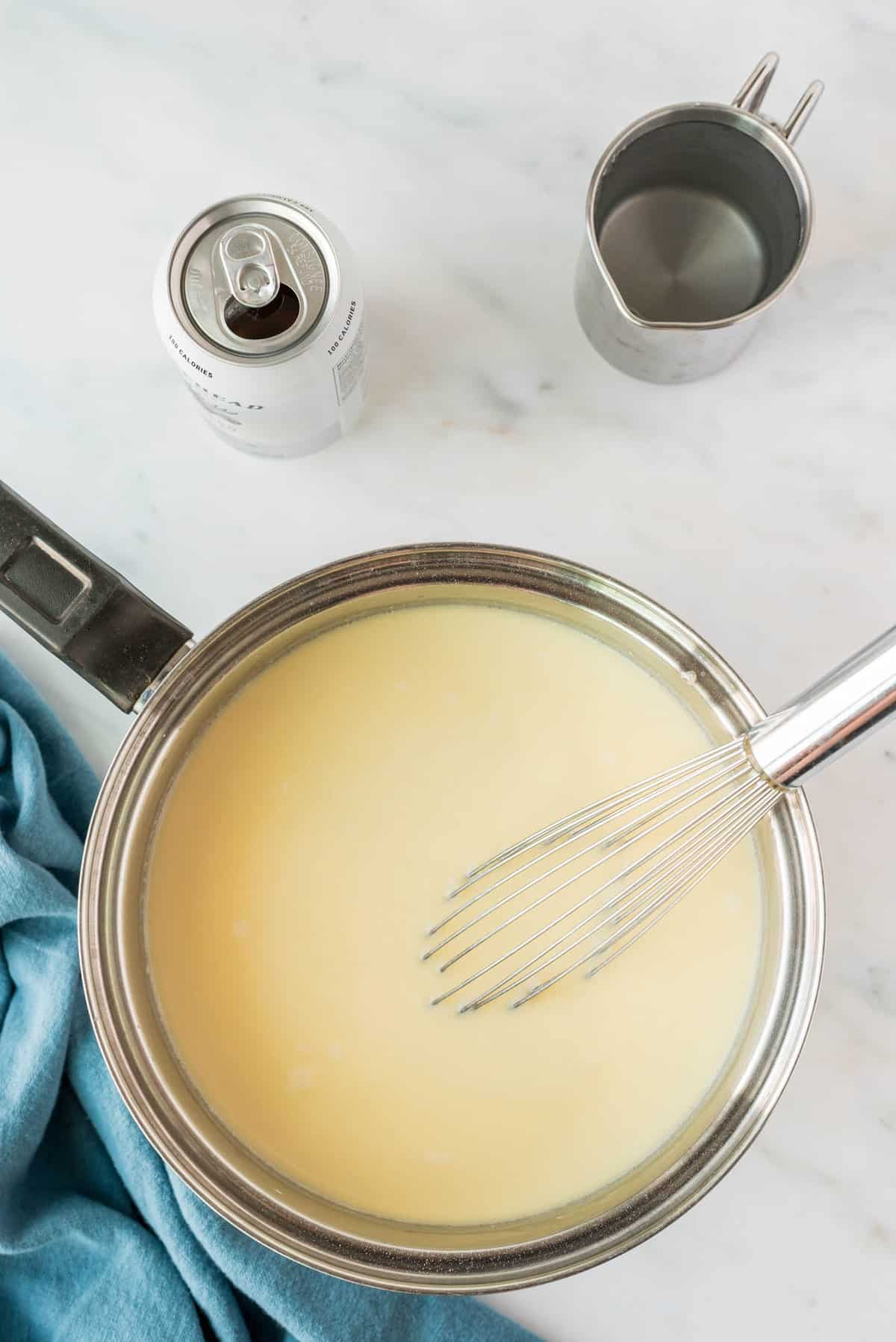 Whisking in Beer to Beer Cheese Soup Recipe