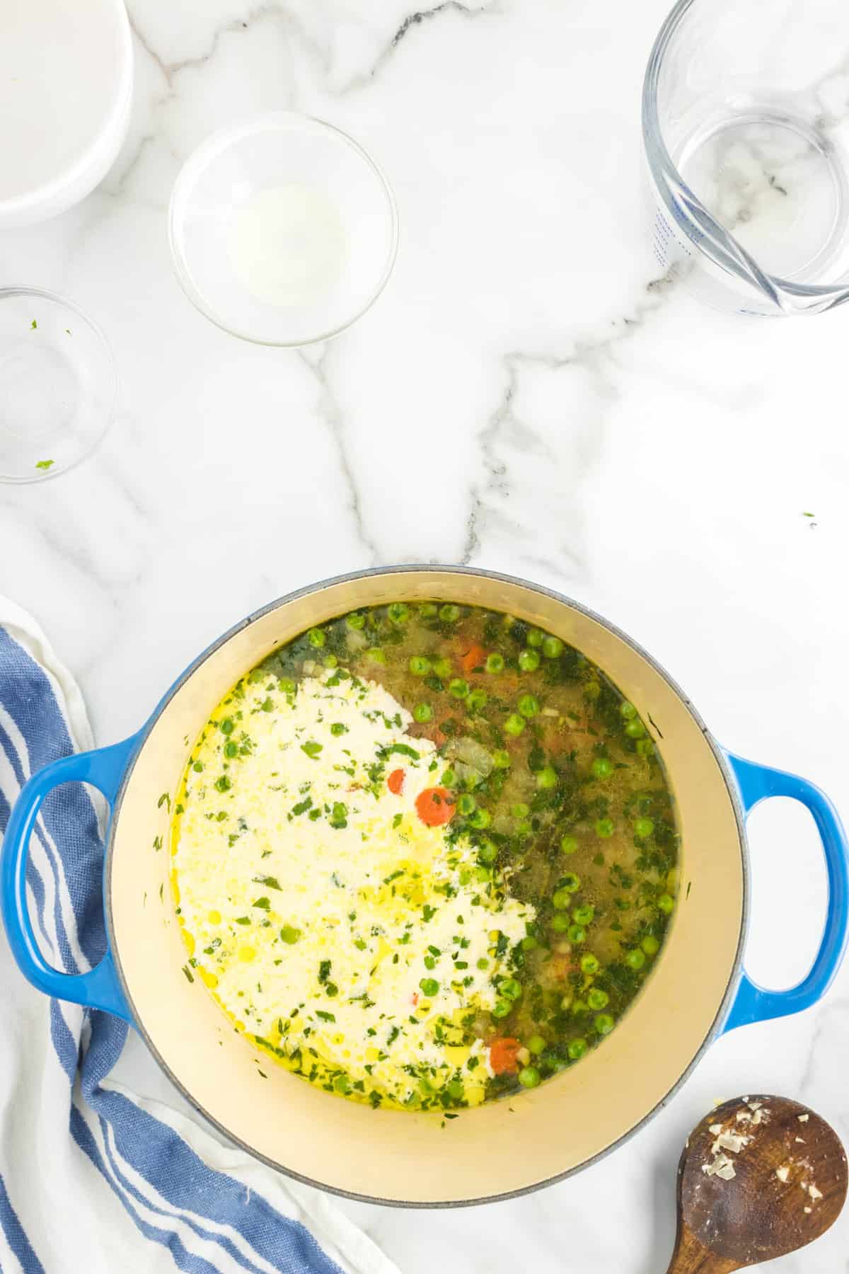 Adding Ingredients to Chicken Pot Pie Soup Recipe in Large Pot