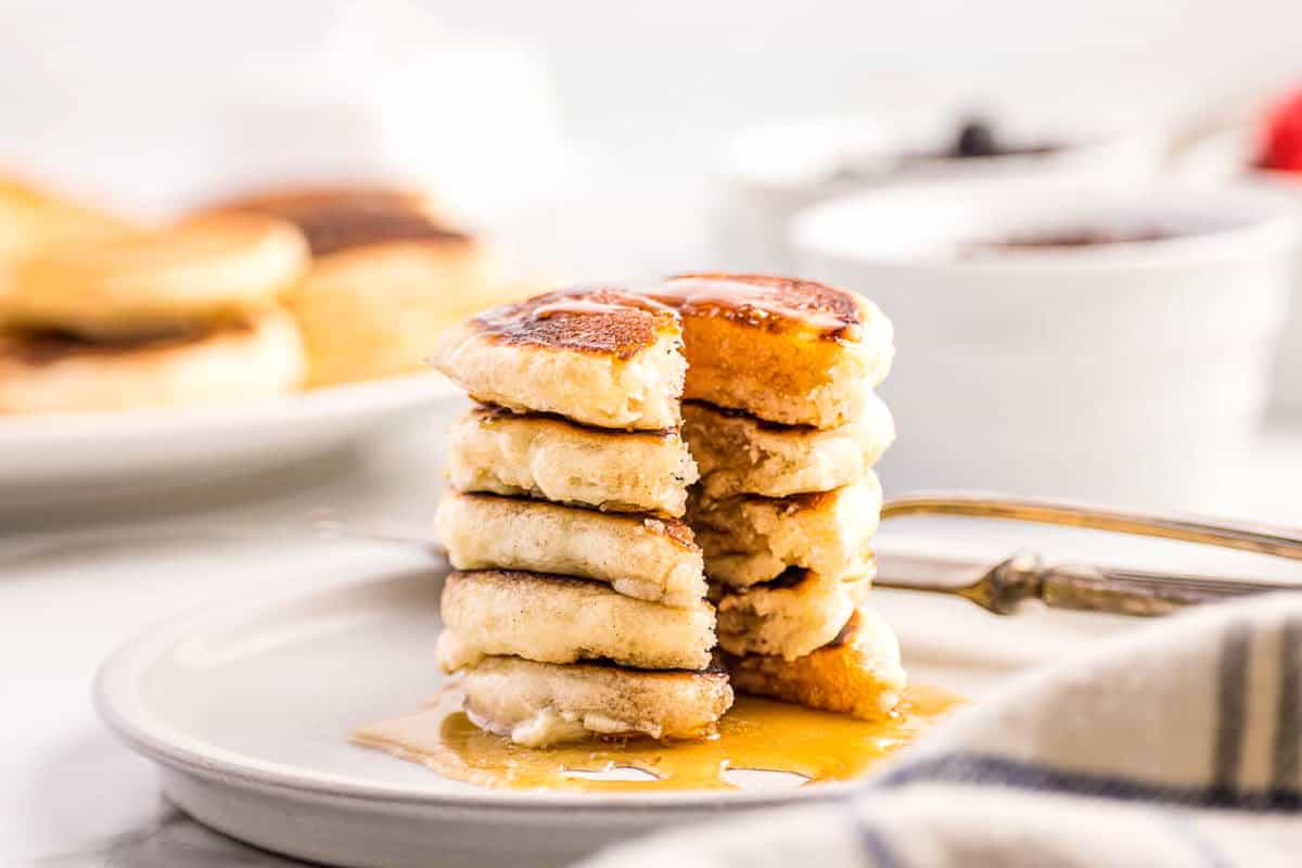 Silver Dollar Pancakes Topped with Syrup on Plate Ready to Enjoy