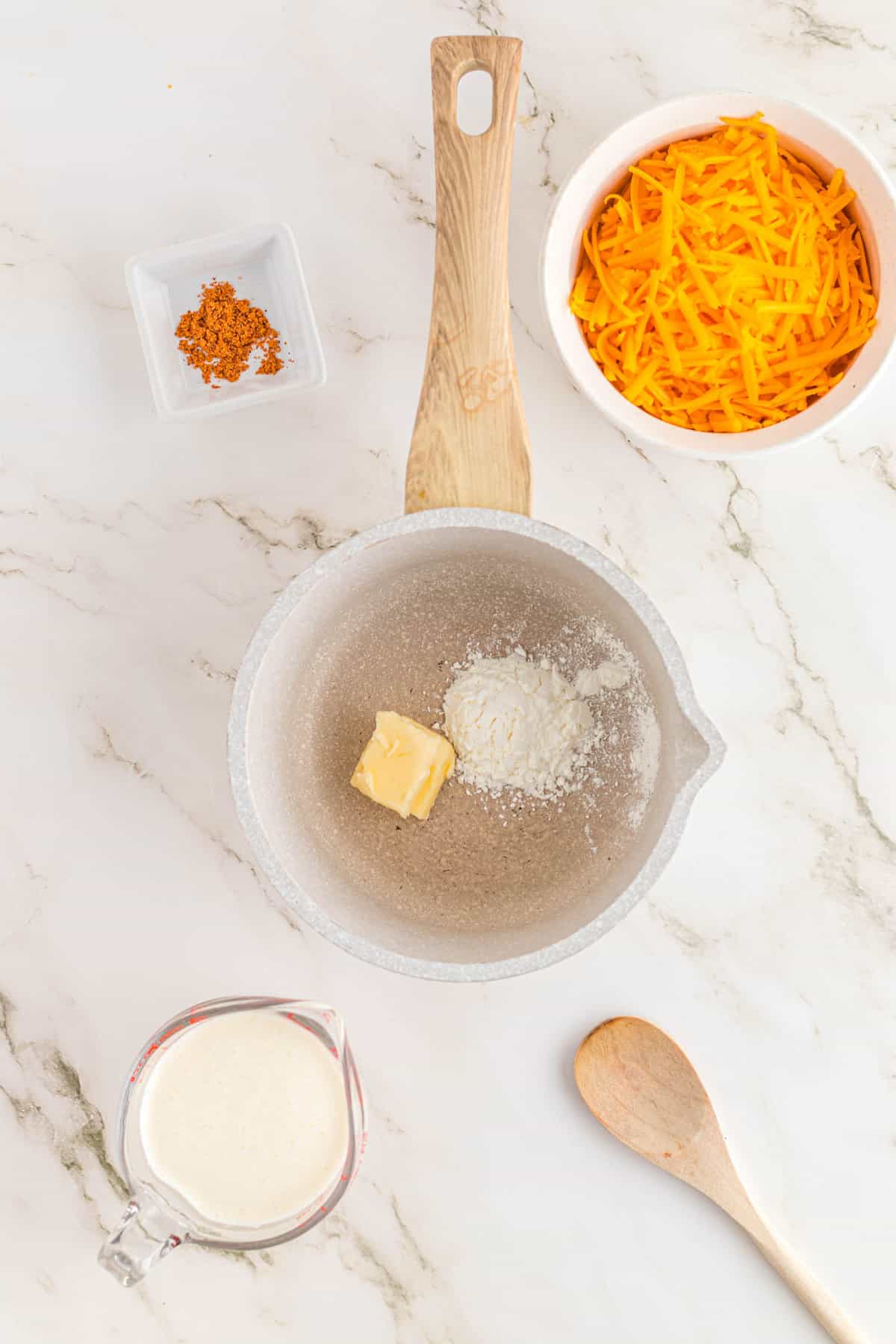 Melting Butter and Cornstartch in Saucepan for Nacho Fries Recipe