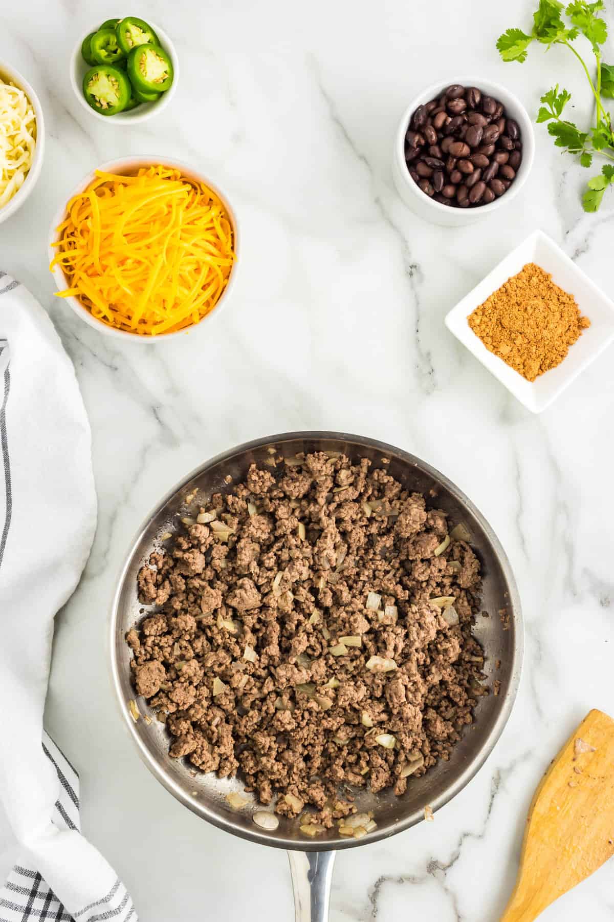 Ground Beef and Onions Browning in Skillet for Loaded Nachos