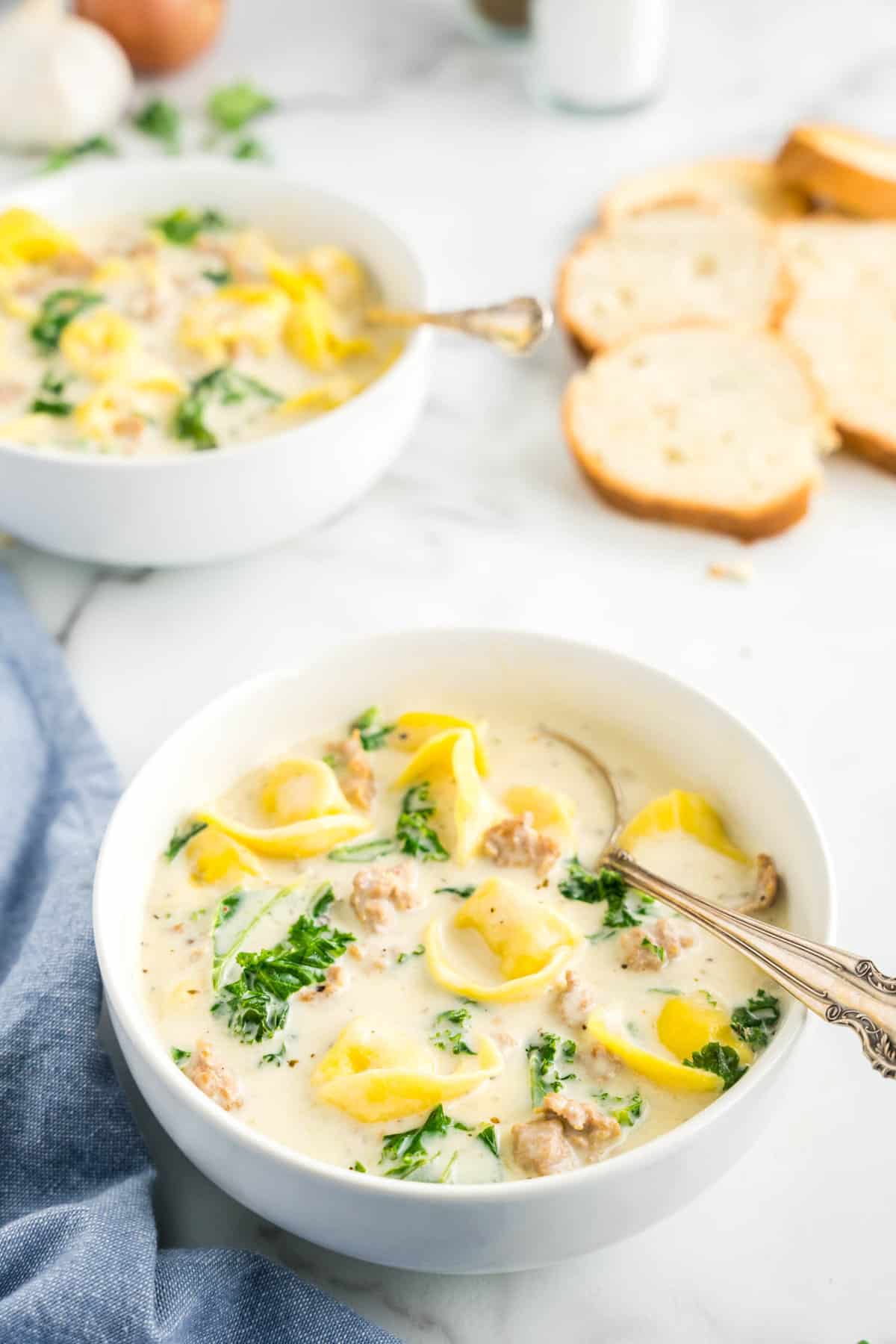 Sausage Tortellini Soup in Bowl with Spoon