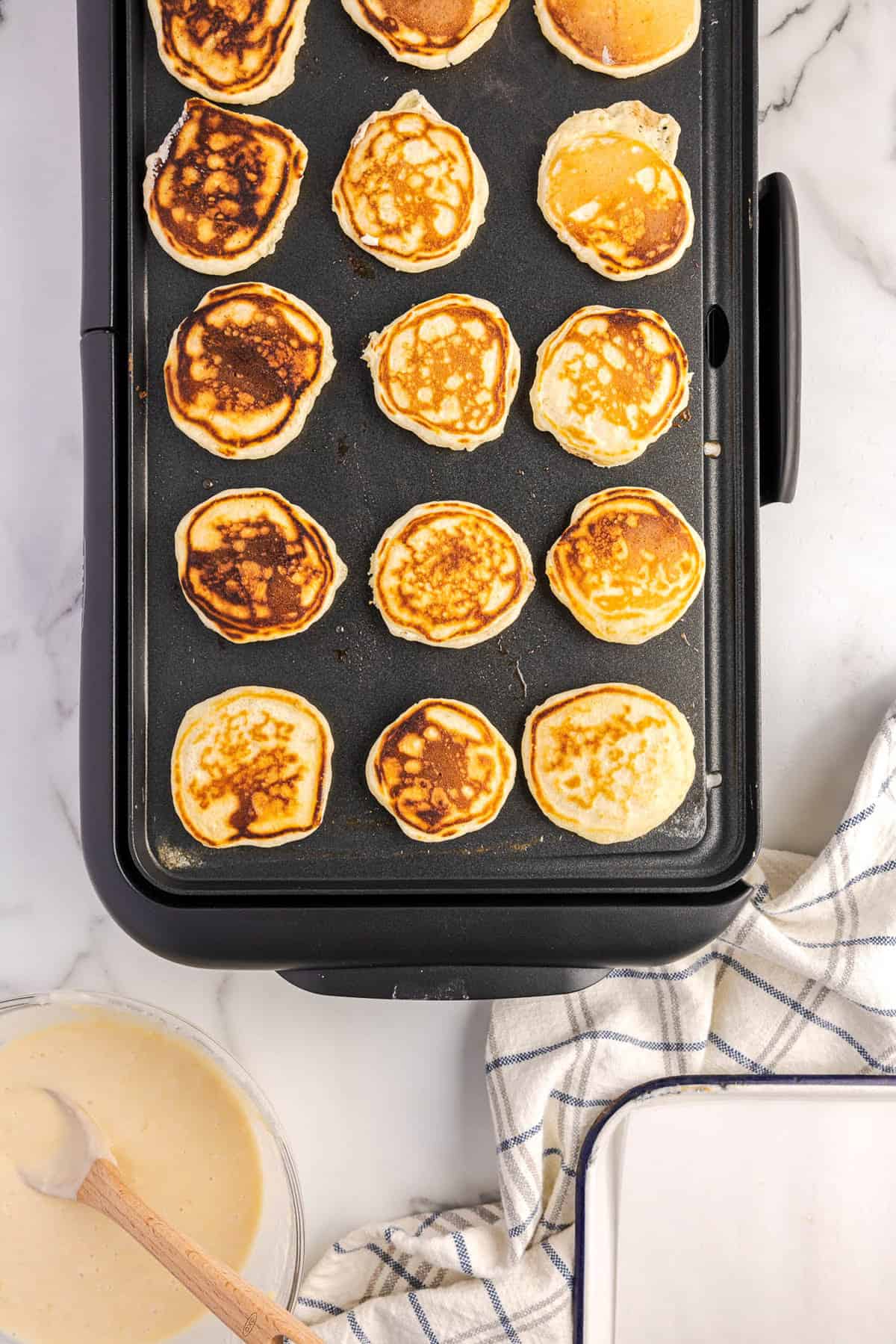 Miniature Panckes on Griddle Overhead Image