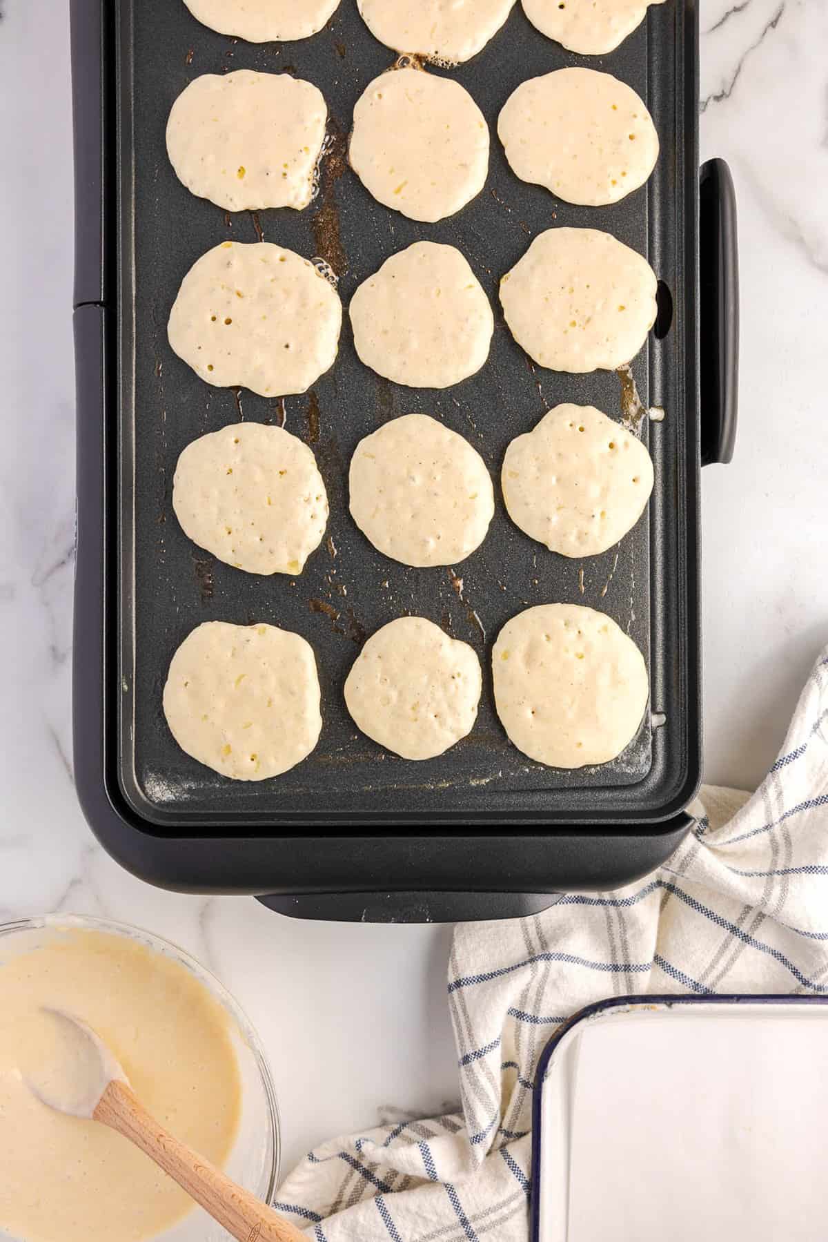 Silver Dollar Panckes Lined on a Griddle