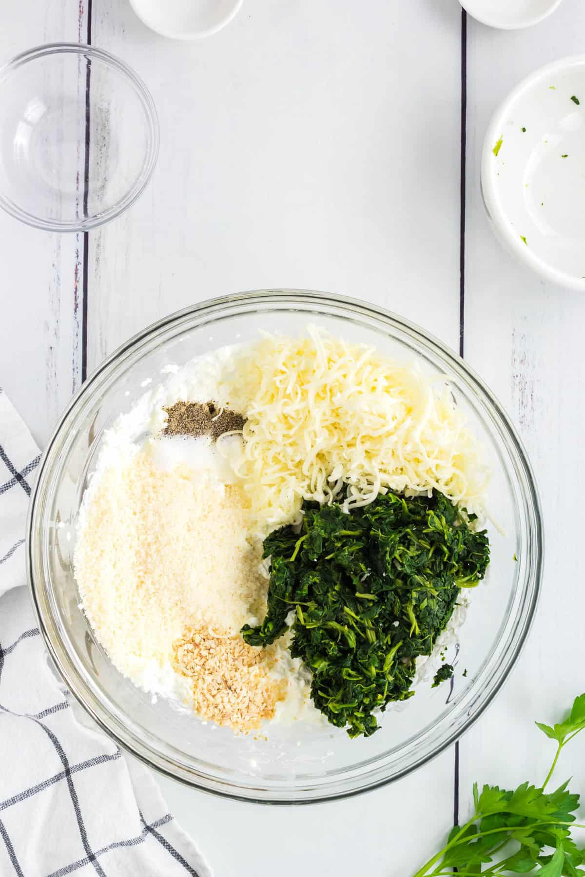 Adding Remaining Ingredients to Mixutre for Easy Hot Spinach Dip Recipe