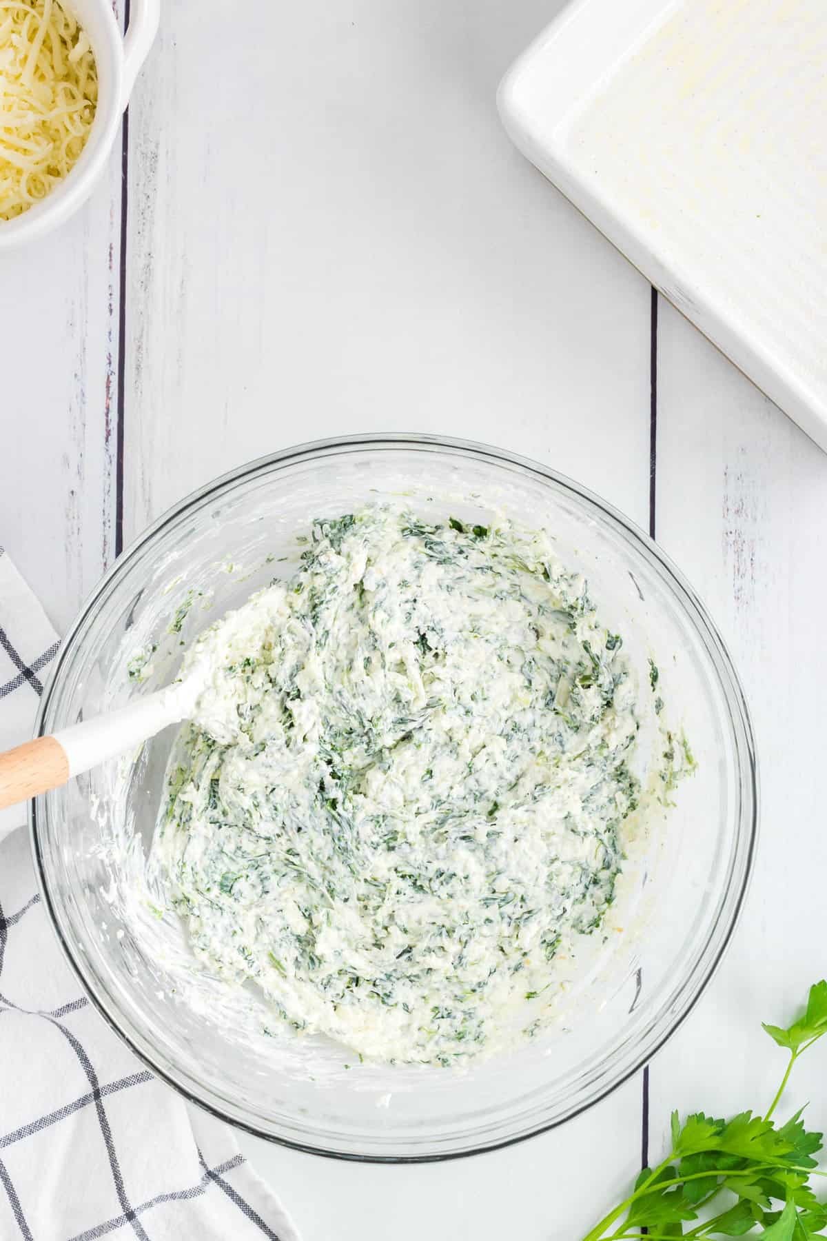 Blending Ingredients with Wooden Spoon in Mixing Bowl for Hot Spinach Dip Recipe