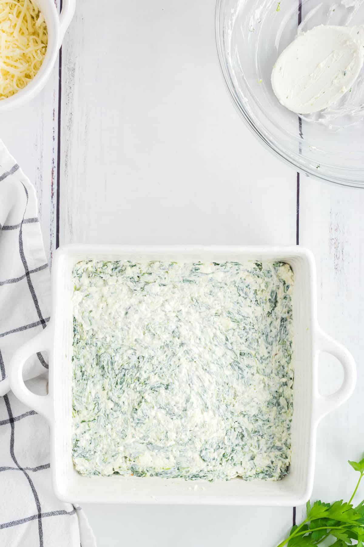Spreading Blended Mixture in Baking Dish for Easy Spinach Dip
