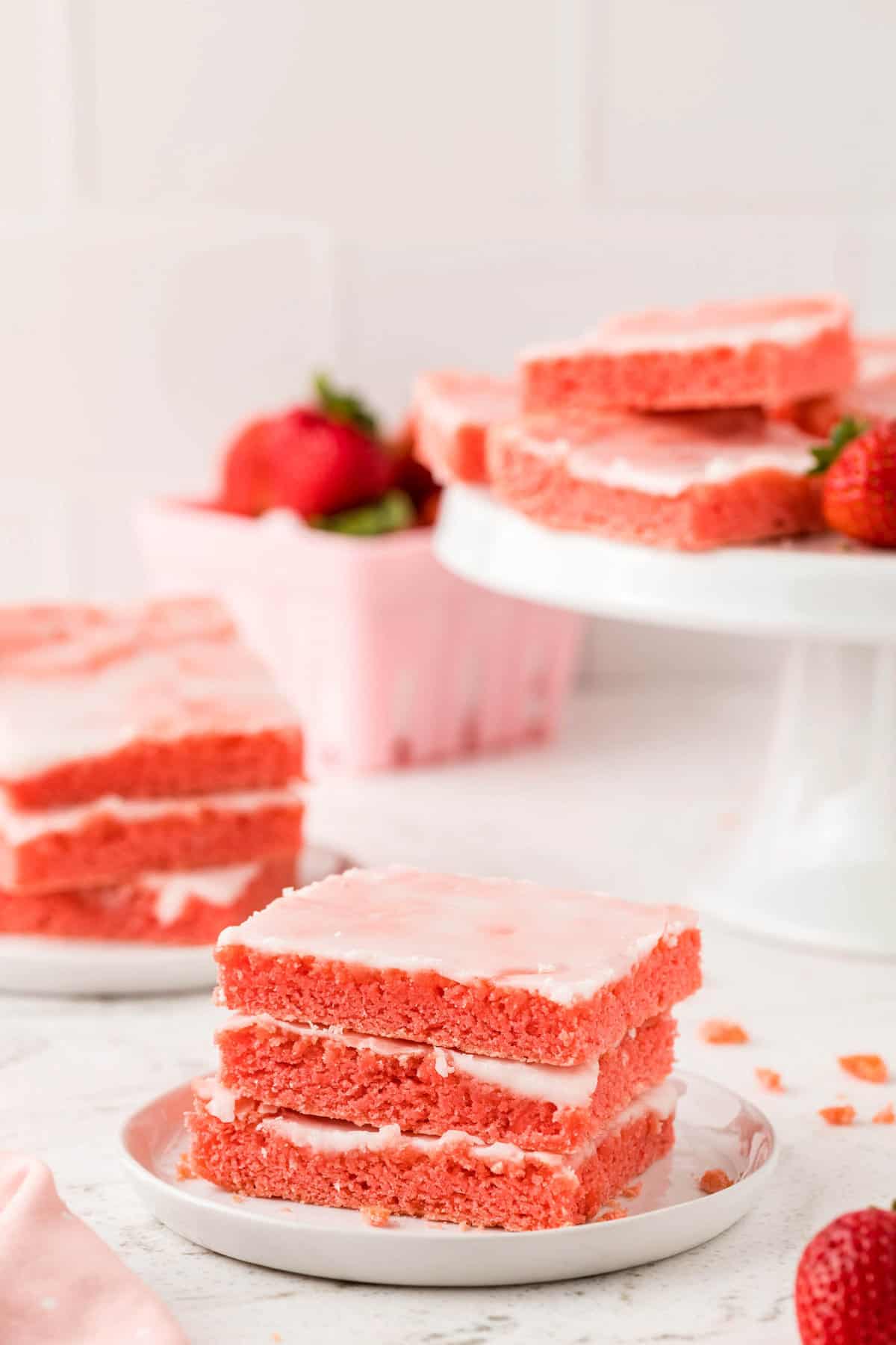 Strawberry Brownies Recipe on Pedestal and Plated Ready to Enjoy