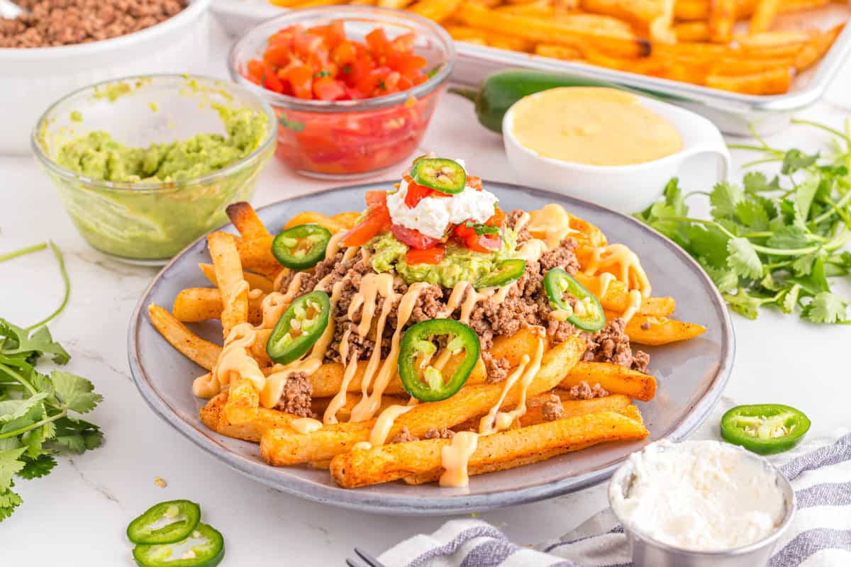 Taco Bell Nacho Fries Plated with all of the Fixings