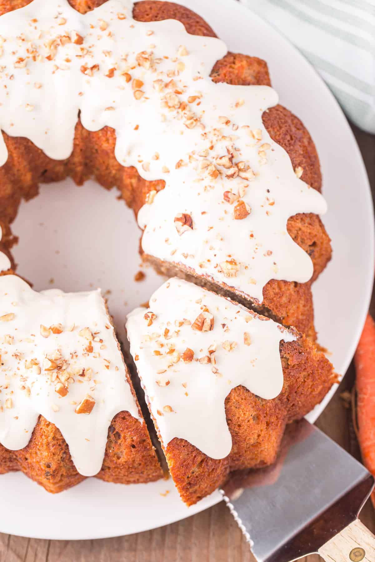 Carrot Bundt Cake Topped with Cream Cheese Frosting Sliced and Ready to Enjoy