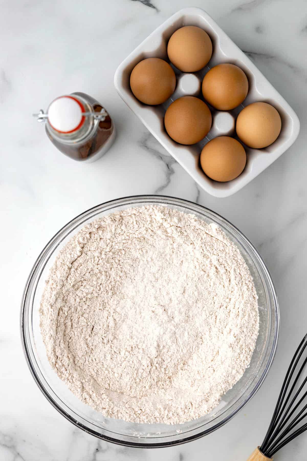 Mixed Dry Ingredients for Carrot Cake Cookies in Clear Mixing Bowl