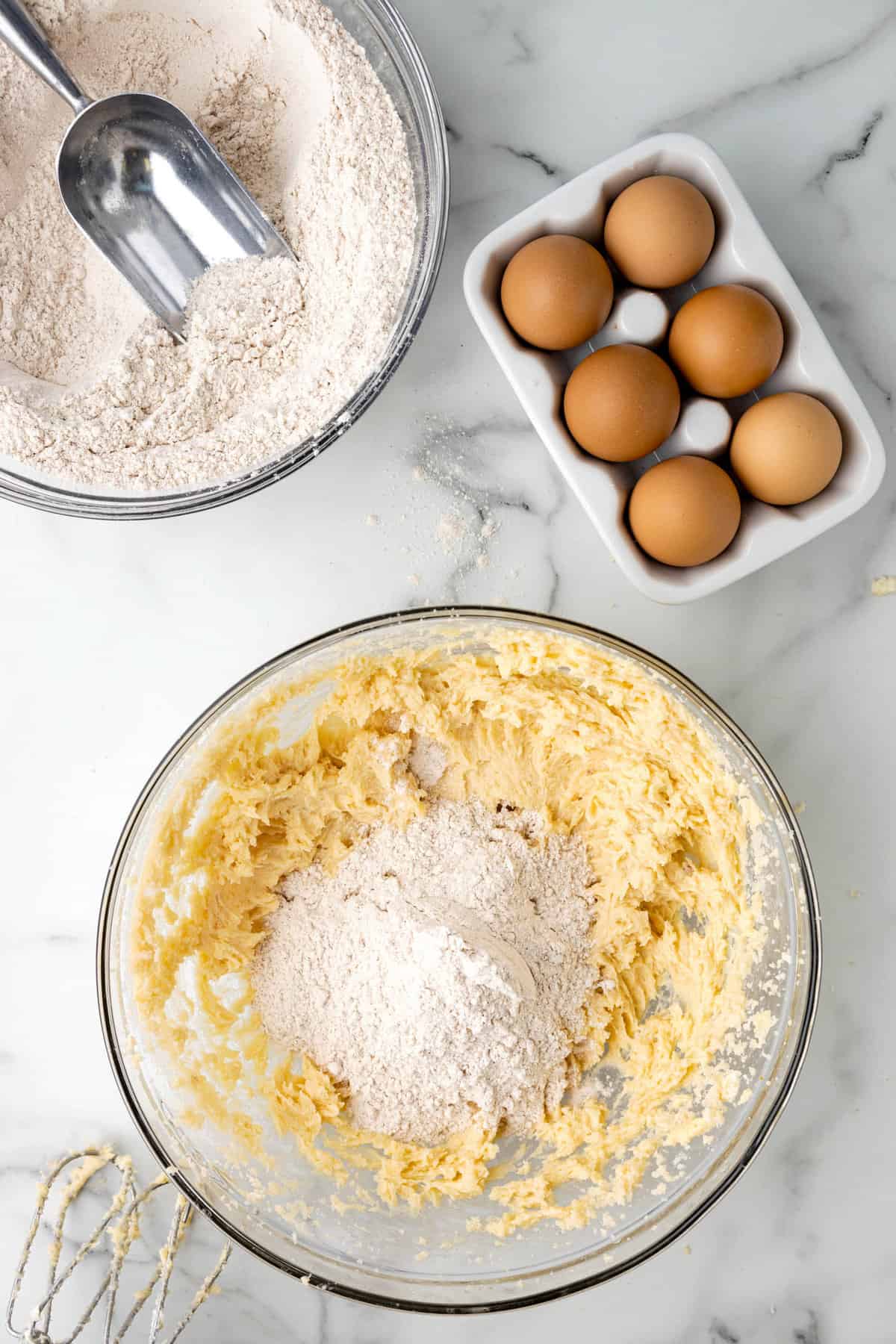 Slowly Adding Dry Mixture to Wet Ingredients for Adding Egg to the Wet Ingredients for Carrot Cake CookiesAdding Egg to the Wet Ingredients for Adding Egg to the Wet Ingredients for Carrot Cake Cookies