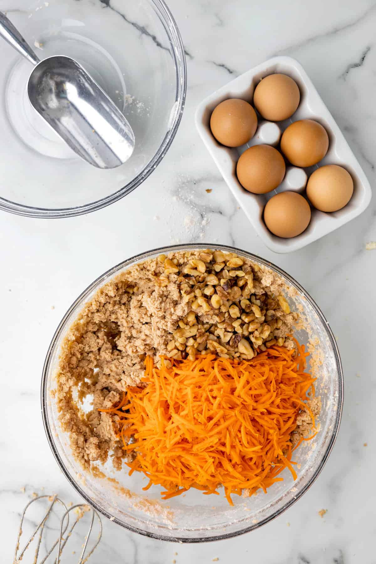 Adding Grated Carrots to Batter Mixture for Carrot Cake Cookies